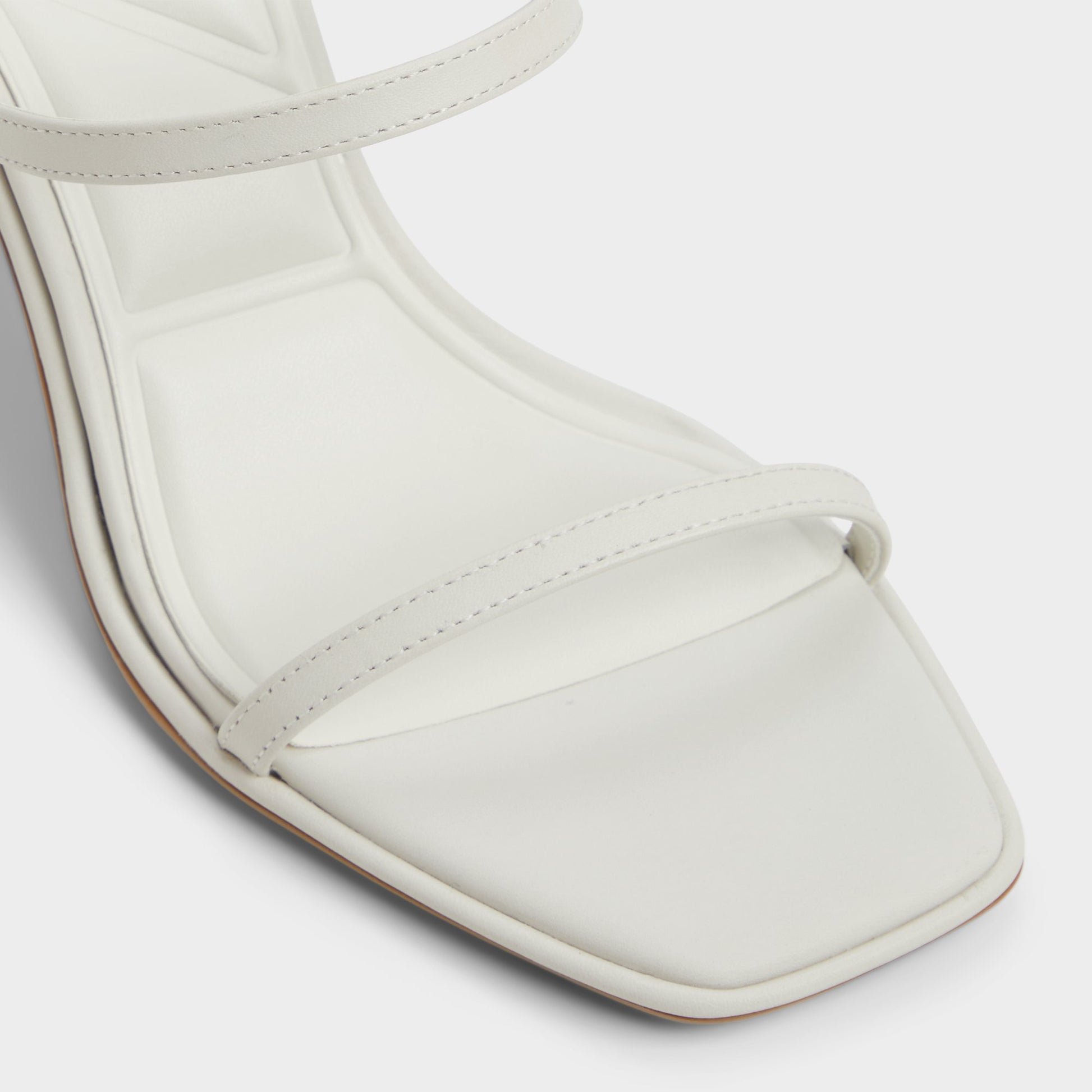 Close-up of the White/Bone Calalden Strappy heeled sandal