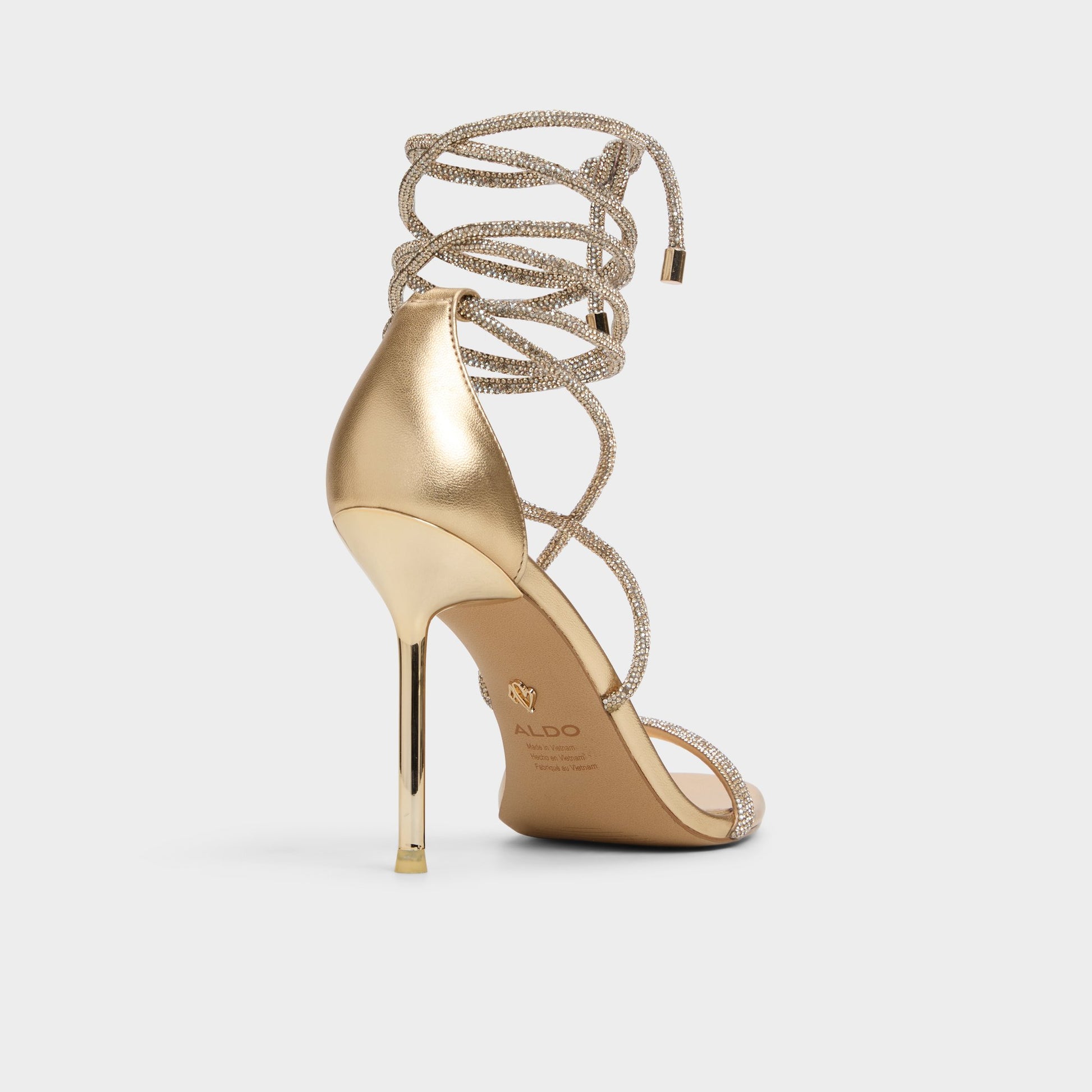 Three-quarter angle of Gold Caladonia Strappy heeled sandal's back side