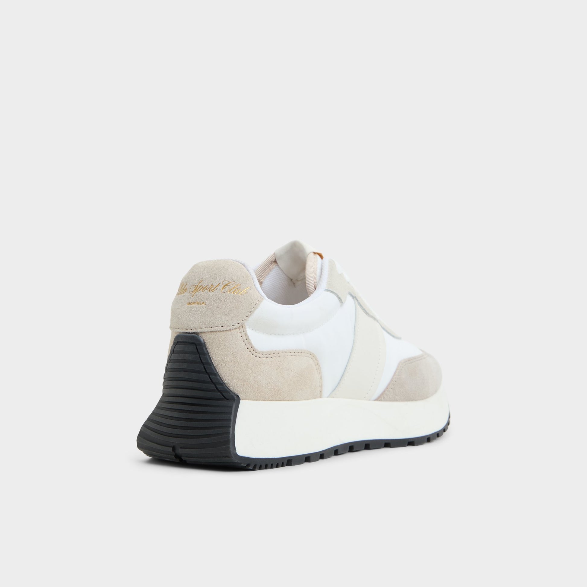 Three-quarter angle of White/Bone Proader Jogger sneaker's back side