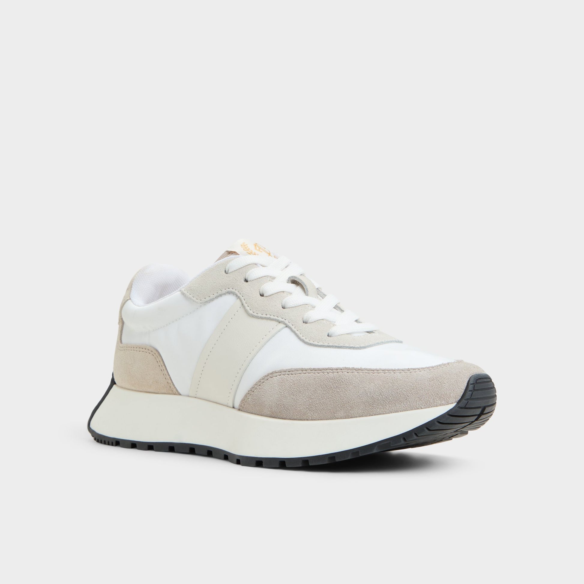 Three-quarter angle of White/Bone Proader Jogger sneaker's front side