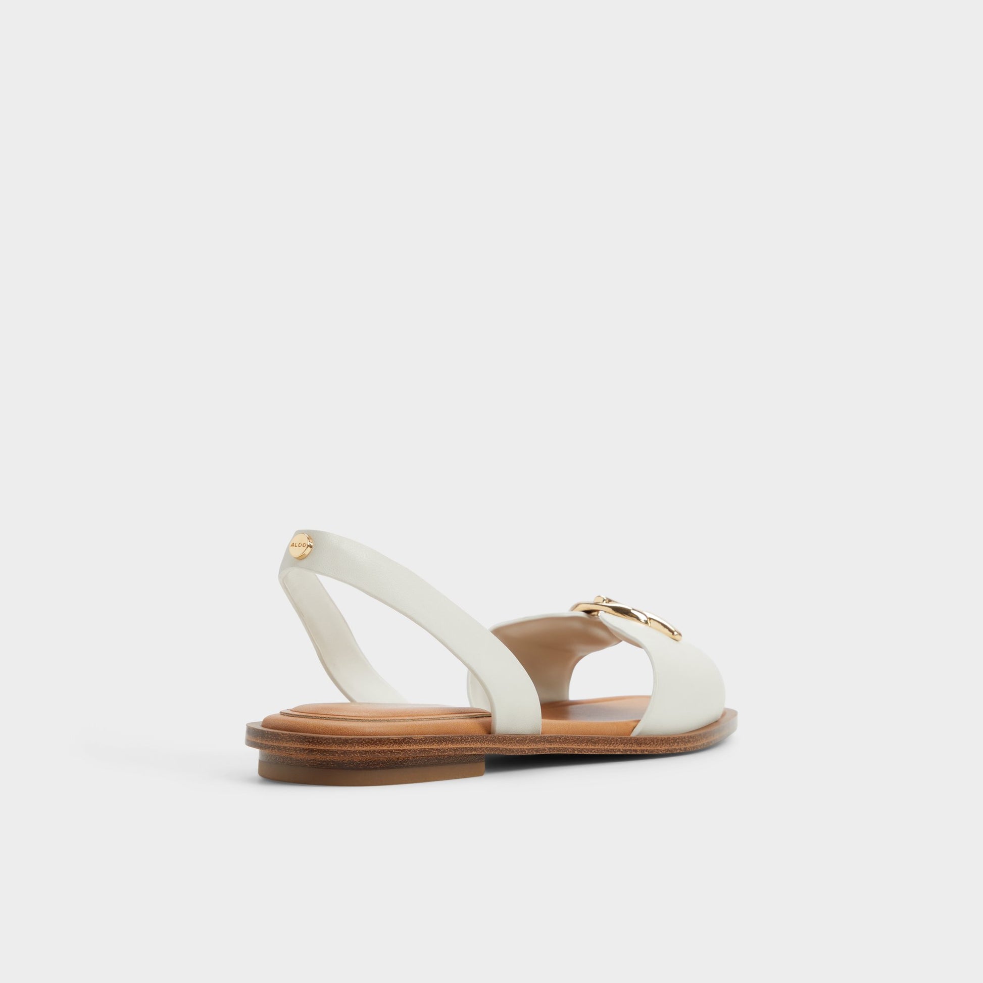 Three-quarter angle of White/bone Goassi Flat sandal's back side