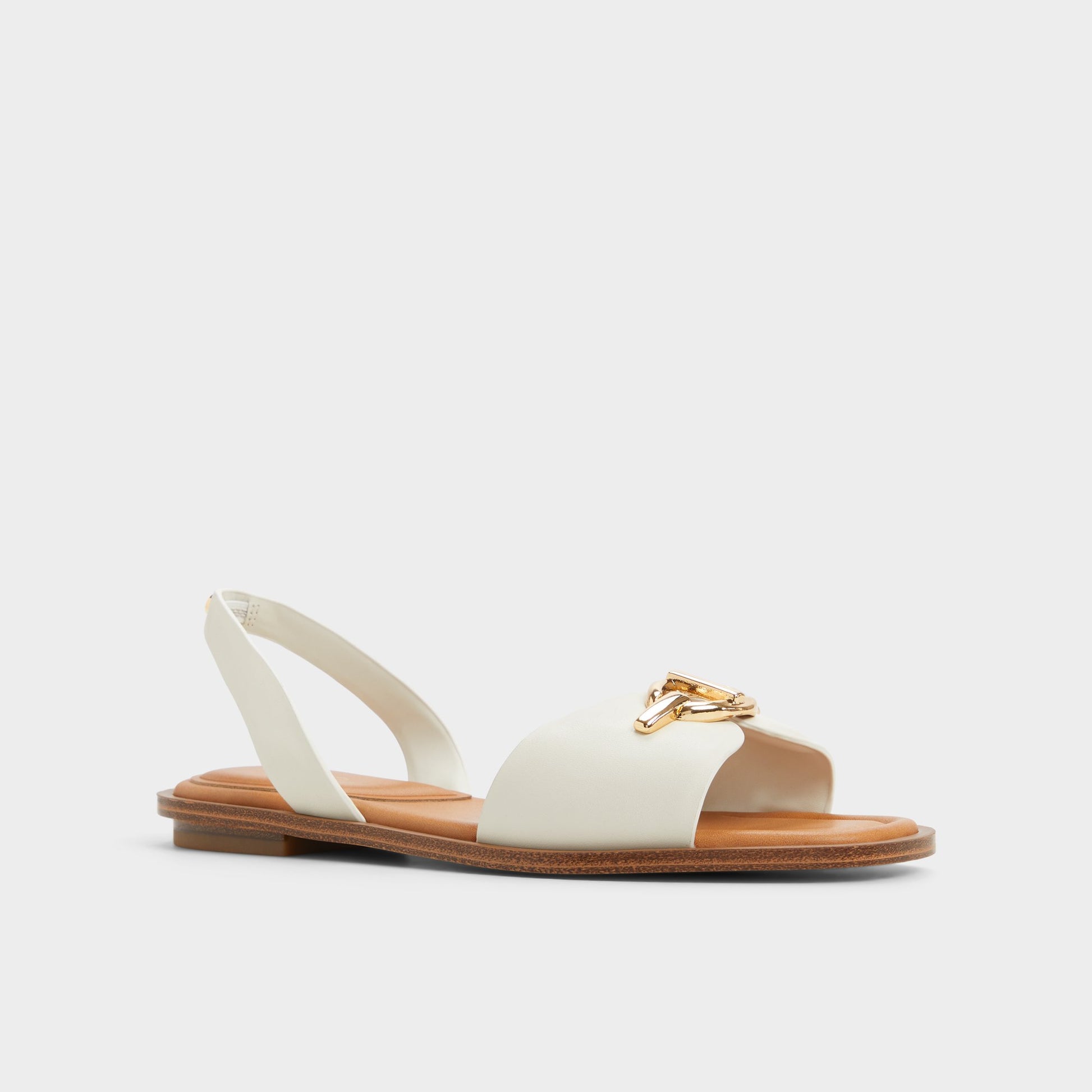Three-quarter angle of White/bone Goassi Flat sandal's front side