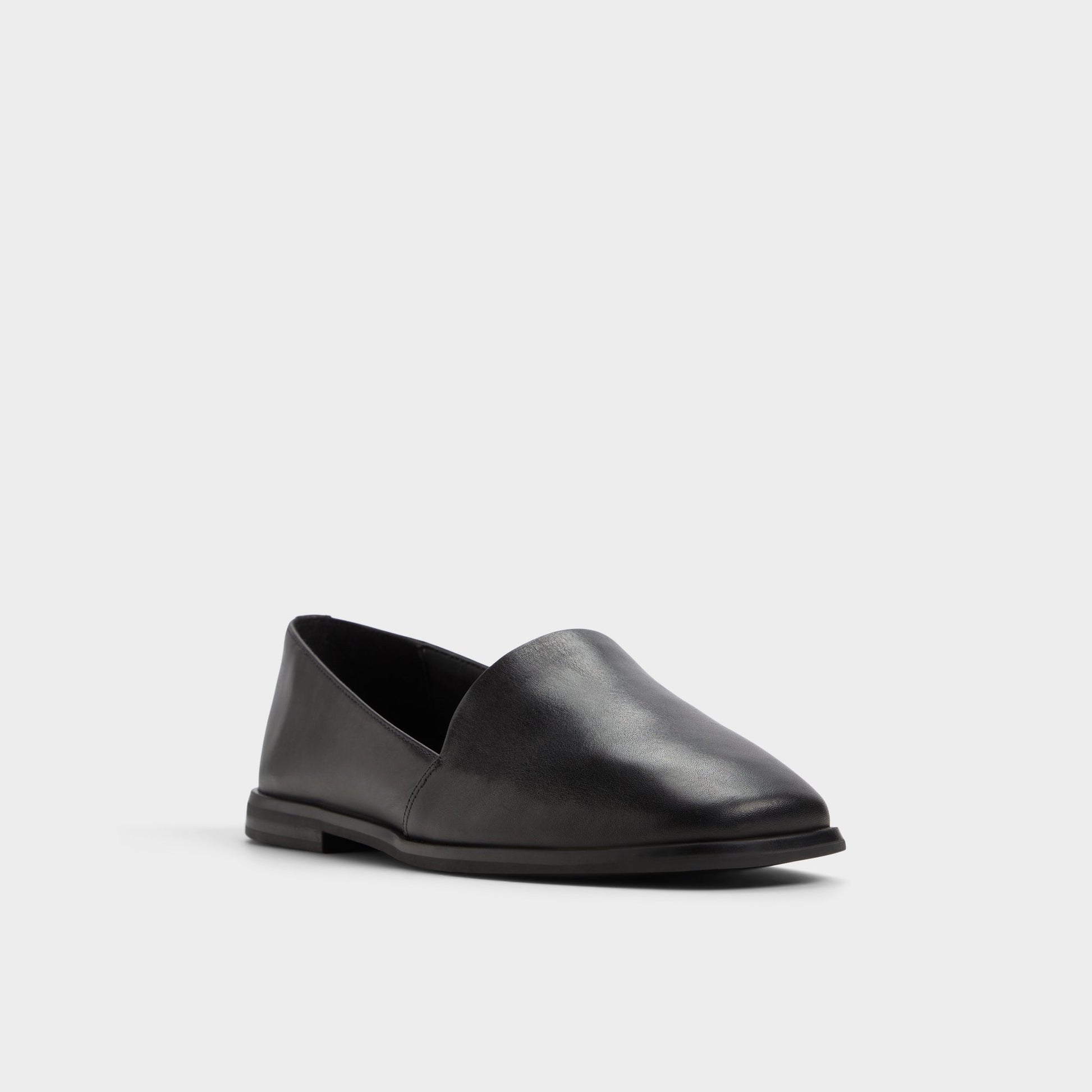 Three-quarter angle of Black Caraelia Slip-on's front side