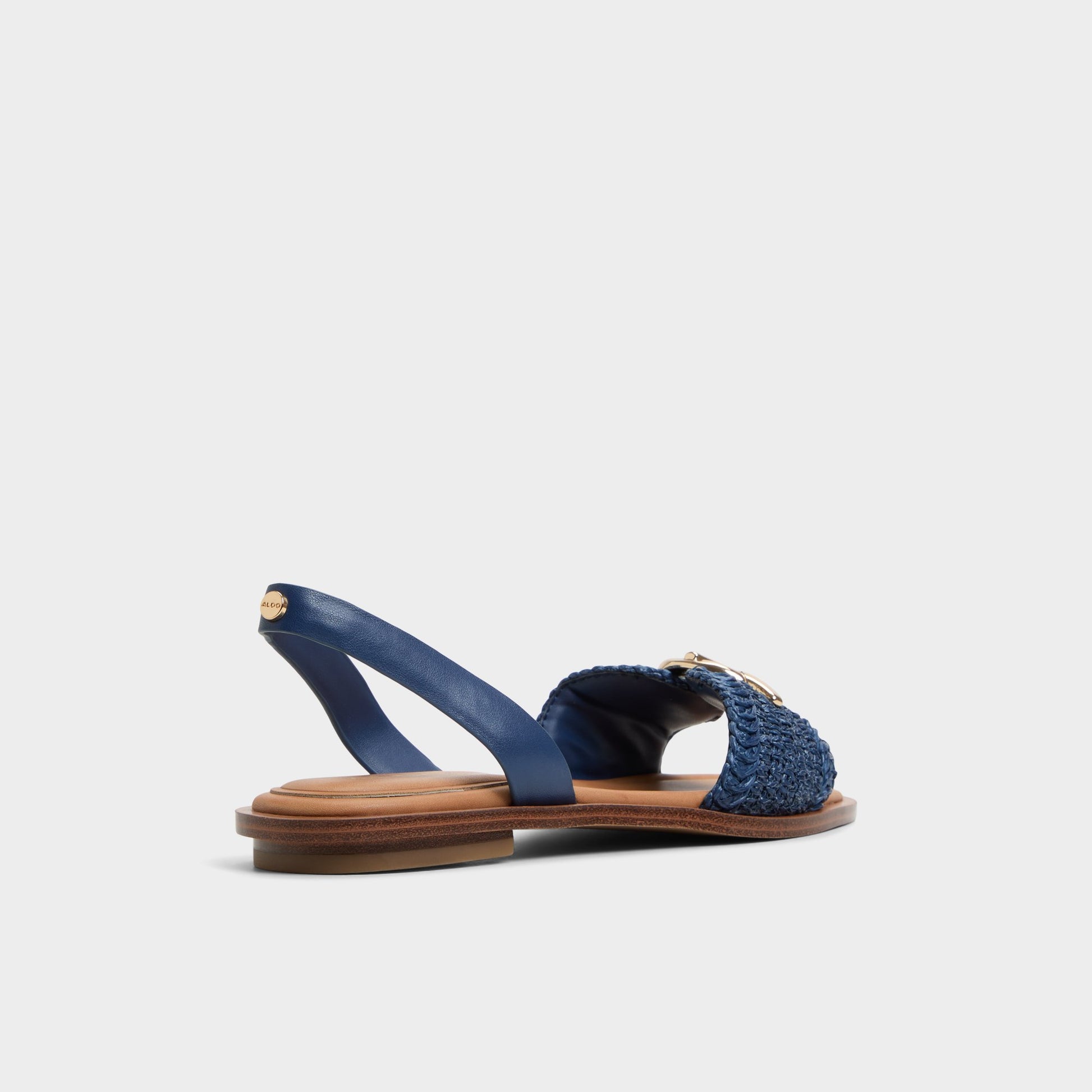 Three-quarter angle of Navy Goassi Flat sandal's back side
