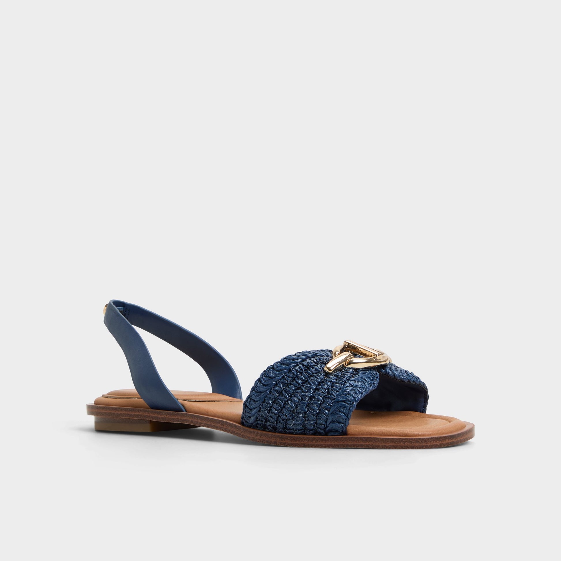 Three-quarter angle of Navy Goassi Flat sandal's front side