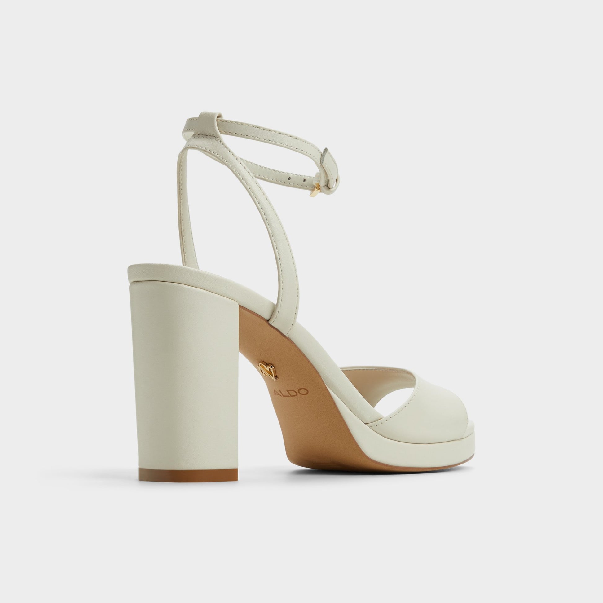 Three-quarter angle of White/Bone Gracious Strappy heeled sandal's back side