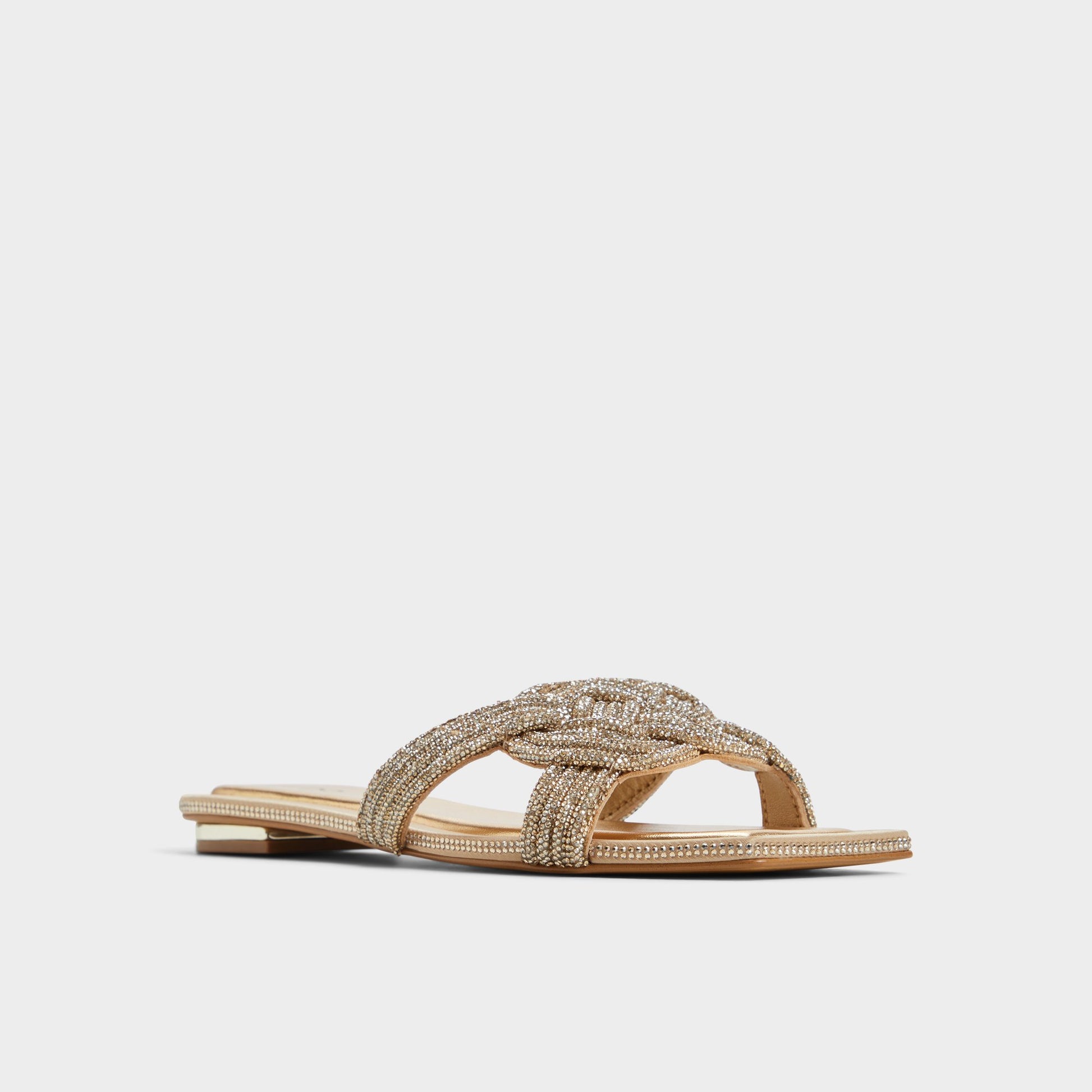 Three-quarter angle of Gold Karlina Slide sandal's front side