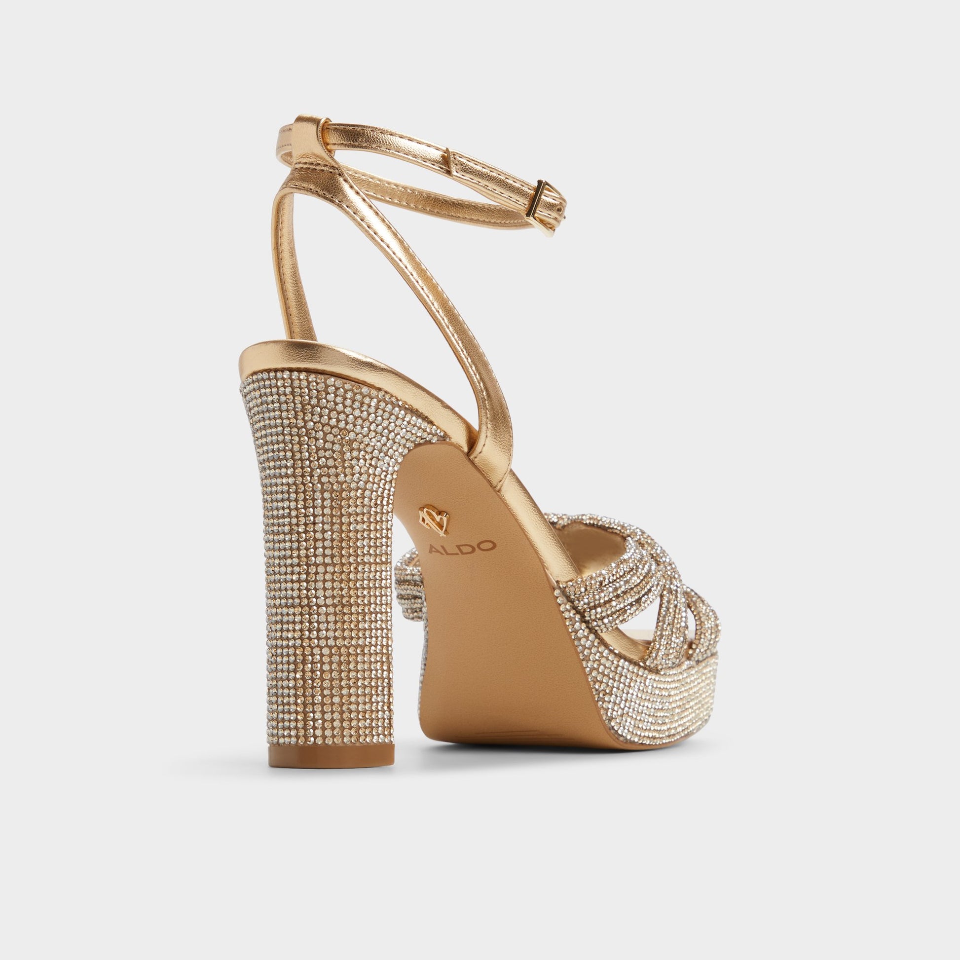 Three-quarter angle of Gold Shimma Strappy heeled sandal's back side