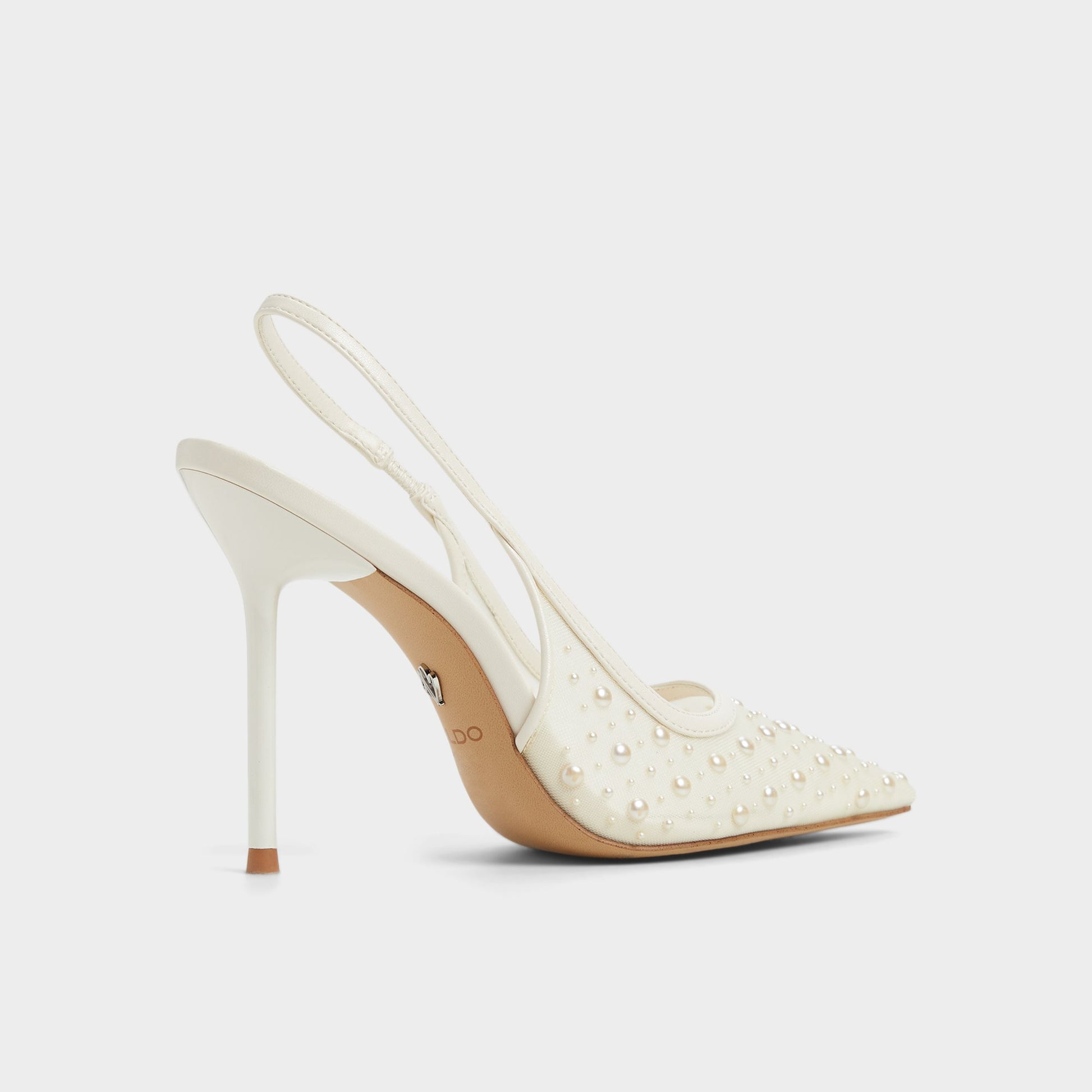 Three-quarter angle of Other White Pearlescent Slingback heel's back side