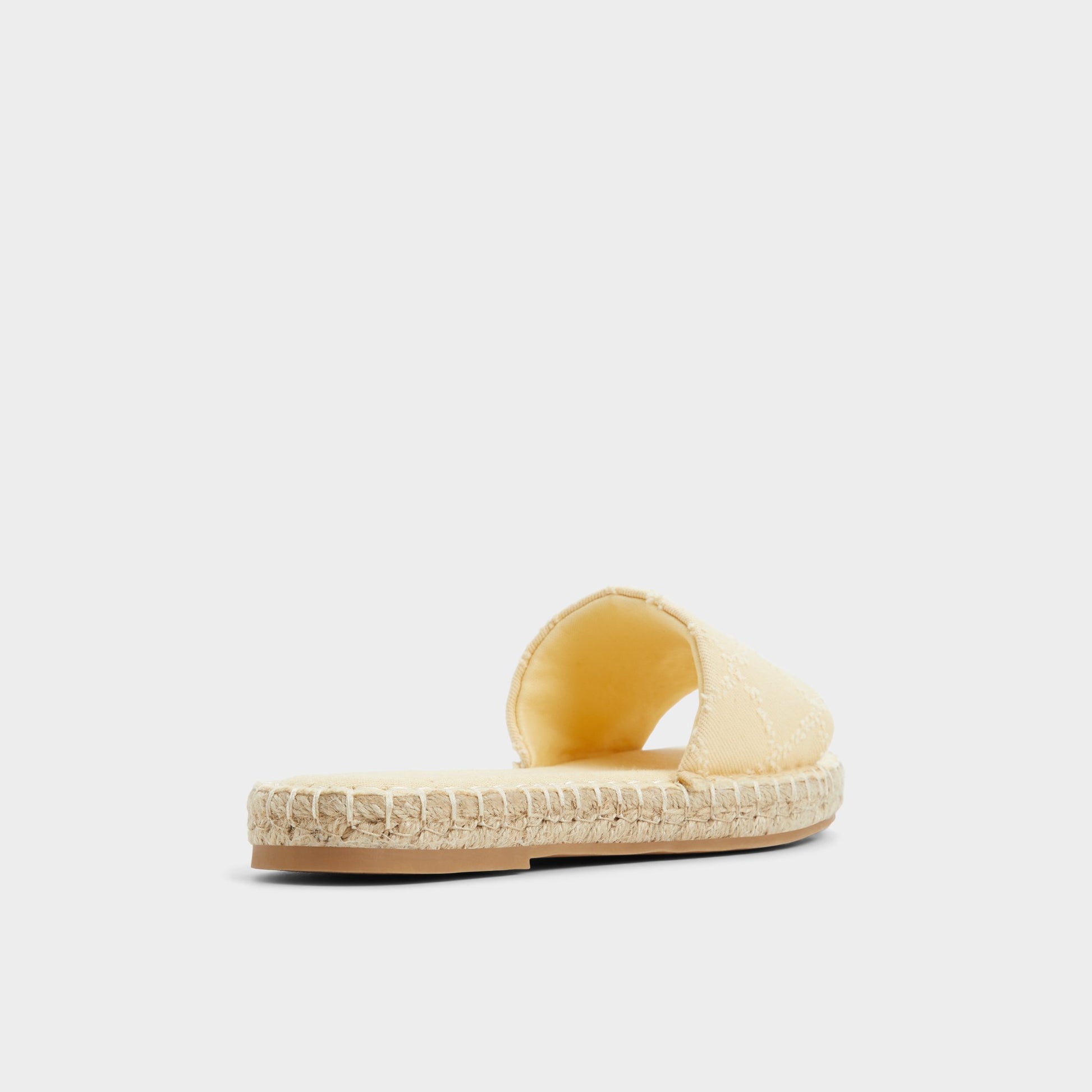 Three-quarter angle of Dark Yellow Erireni Slide sandal's back side