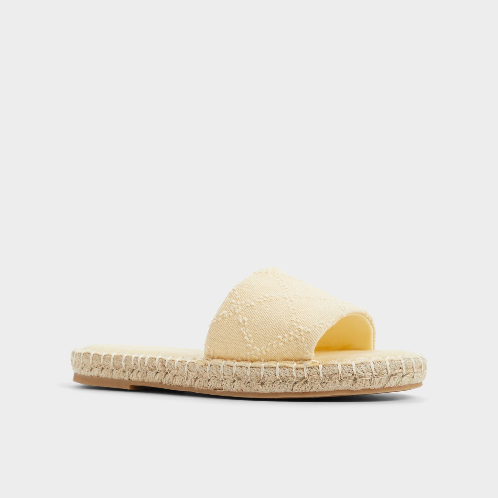 Three-quarter angle of Dark Yellow Erireni Slide sandal's front side