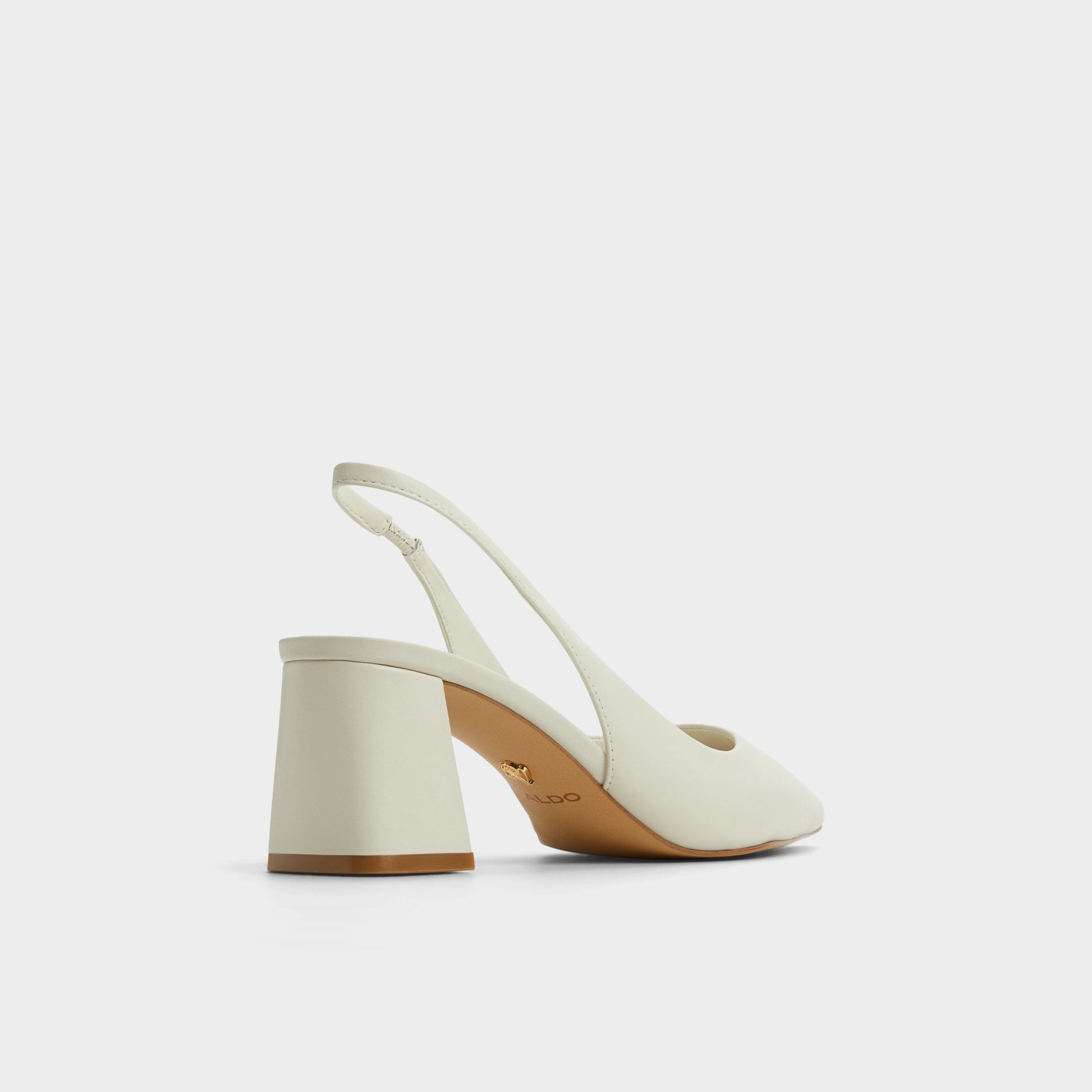 Three-quarter angle of White/Bone Uliana Slingback heel's back side