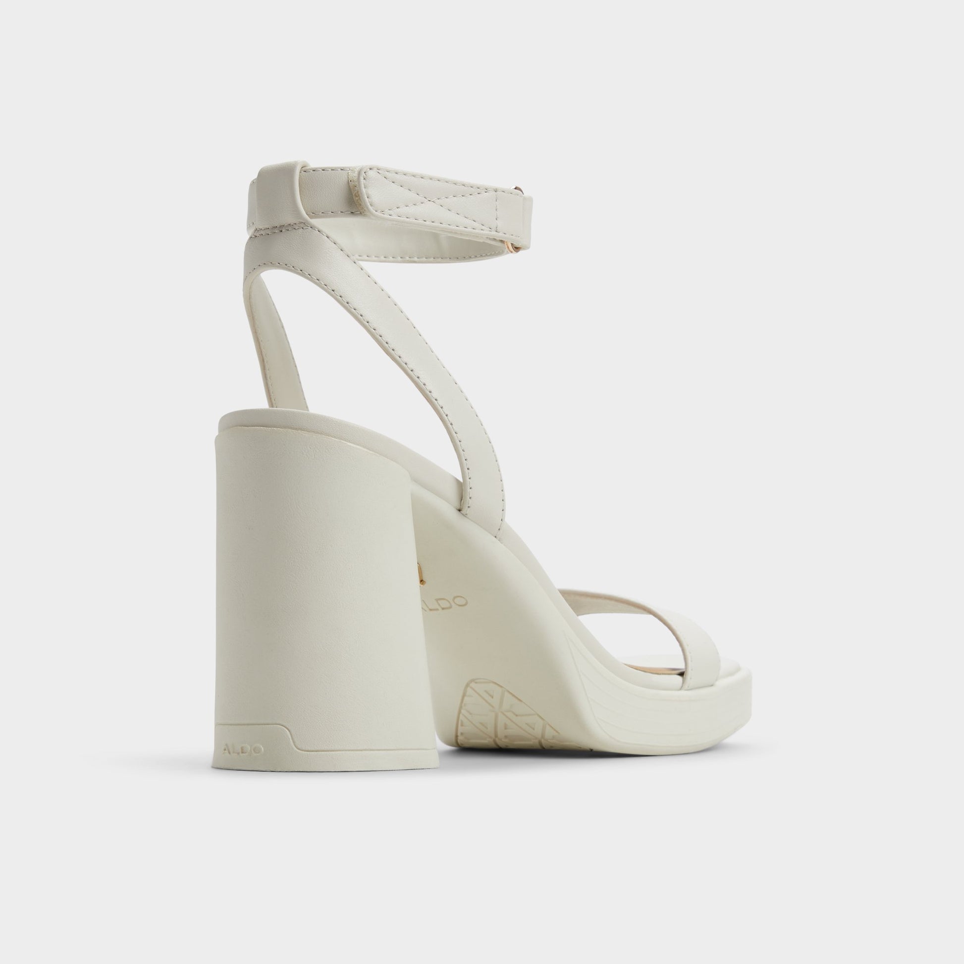 Three-quarter angle of White/Bone Berade Strappy heeled sandal's back side