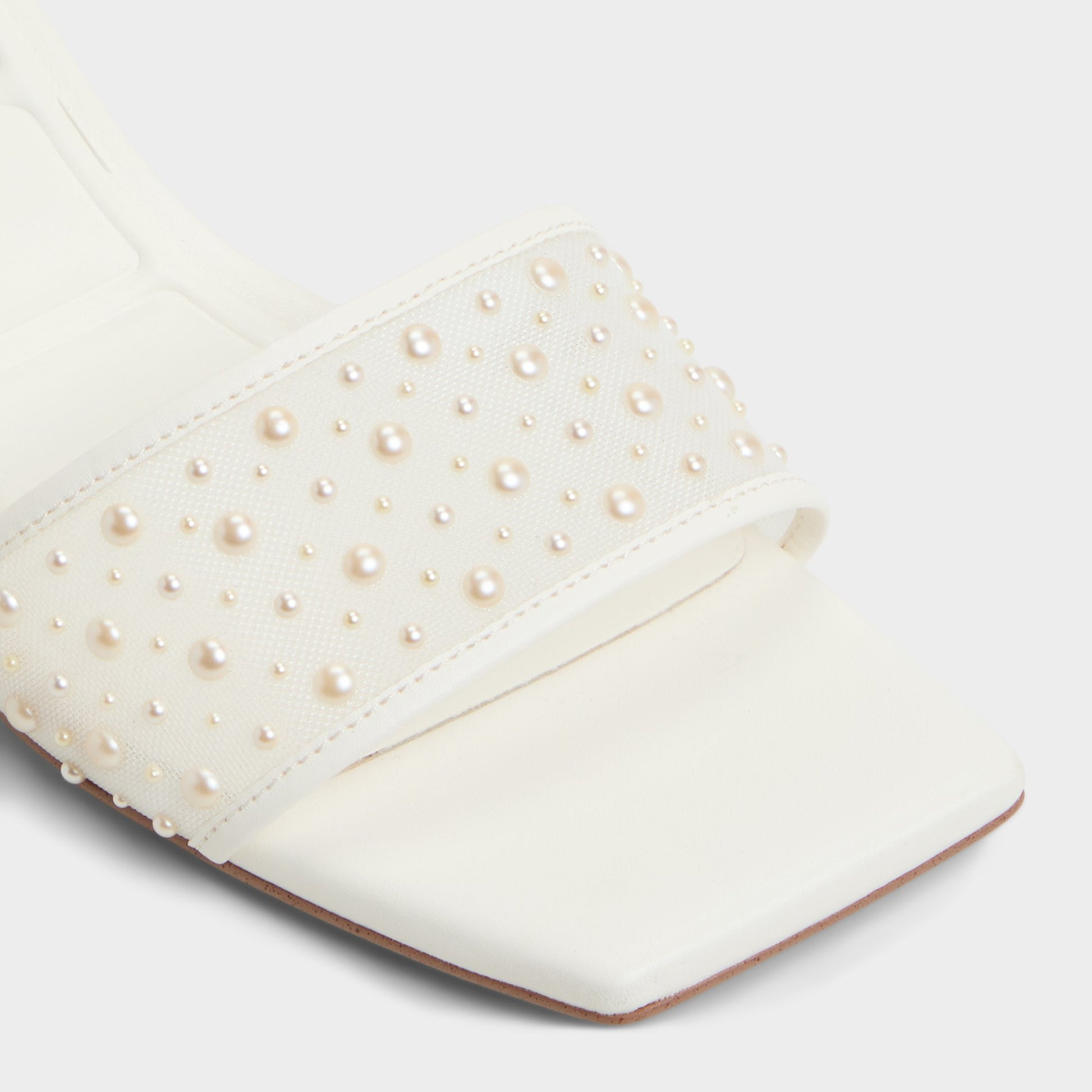 Close-up of the White Pearlia Heeled mule