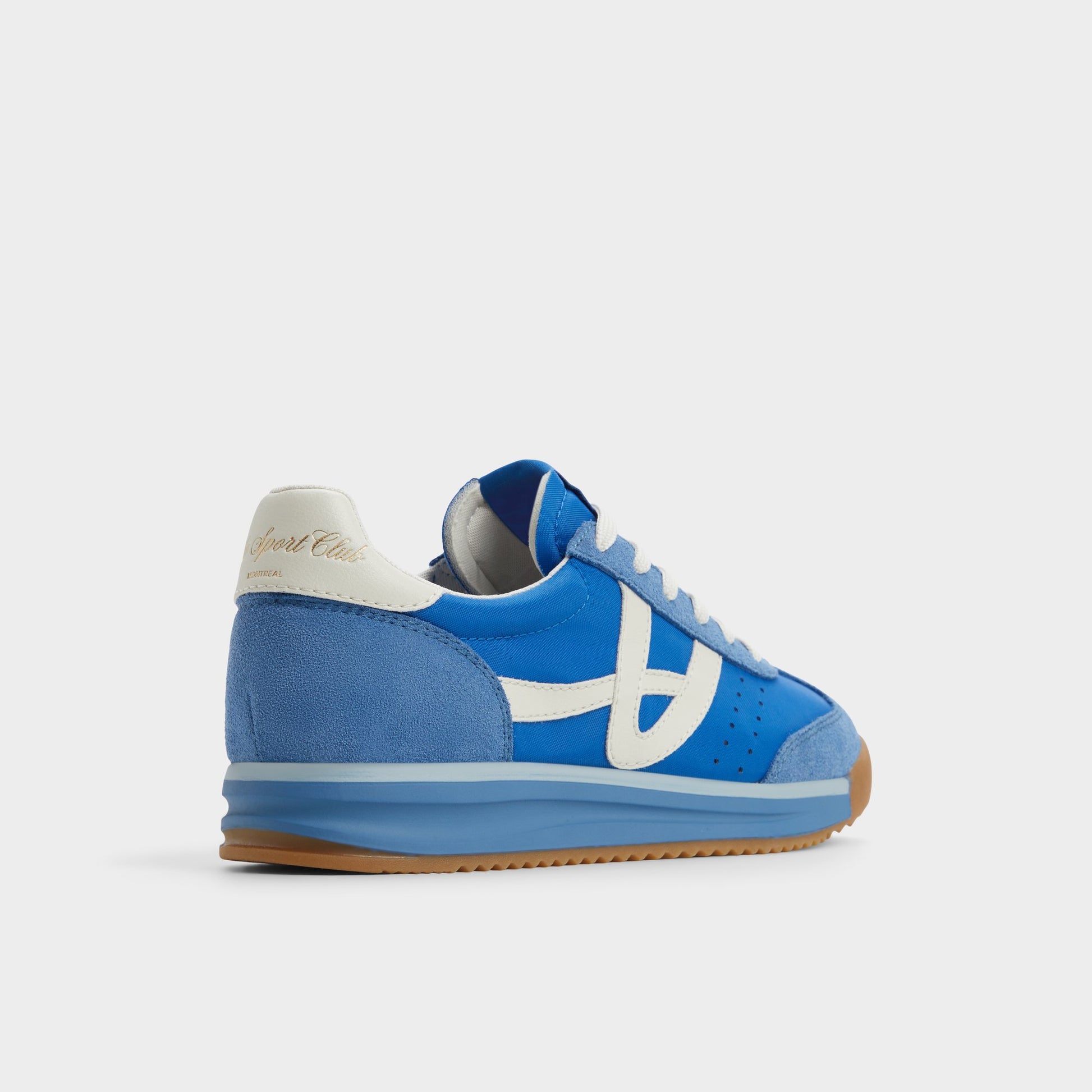 Three-quarter angle of Blue Combo Stepcount Jogger sneaker's back side