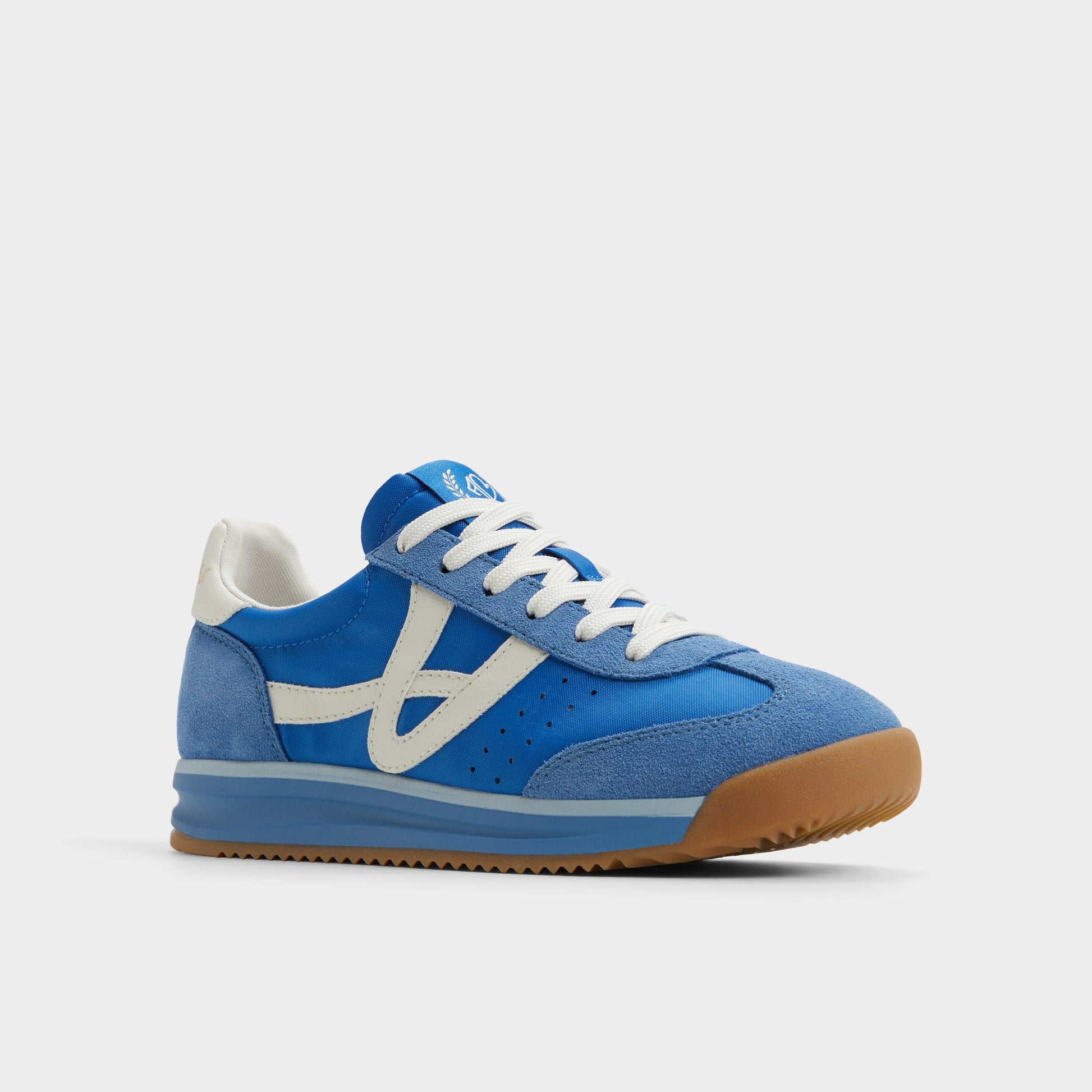 Three-quarter angle of Blue Combo Stepcount Jogger sneaker's front side