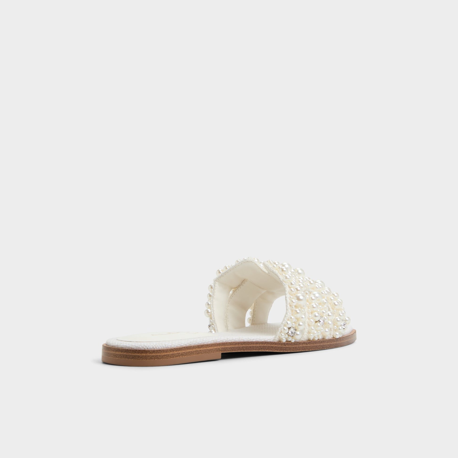 Three-quarter angle of White Multi Eleny Slide sandal's back side