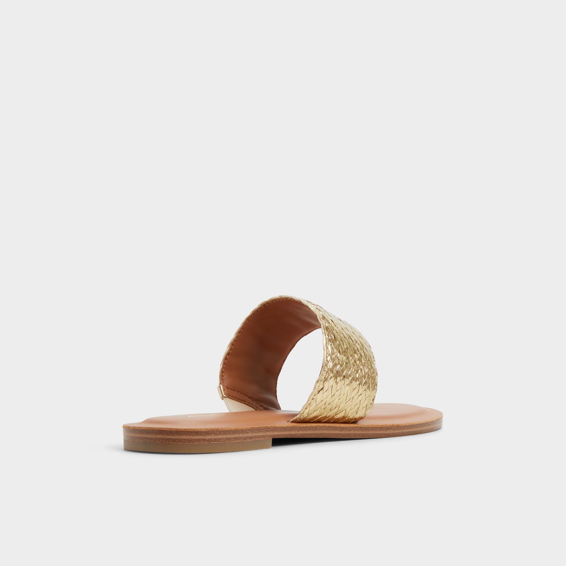 Three-quarter angle of Gold Beachwalk Slide sandal's back side