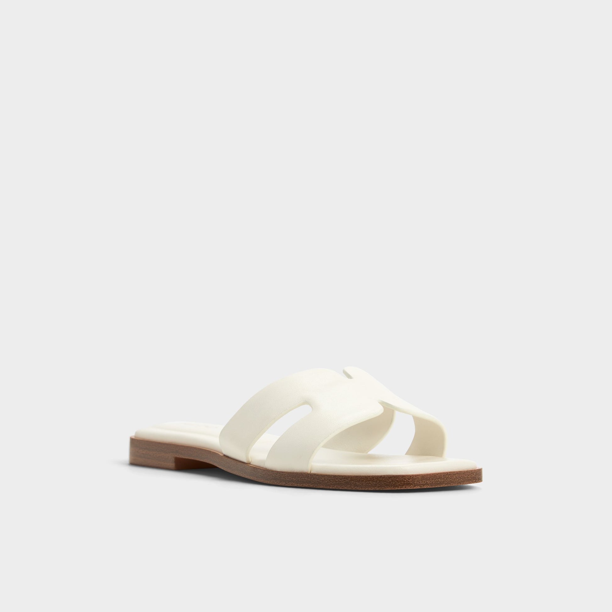 Three-quarter angle of White Itsandal Slide sandal's front side