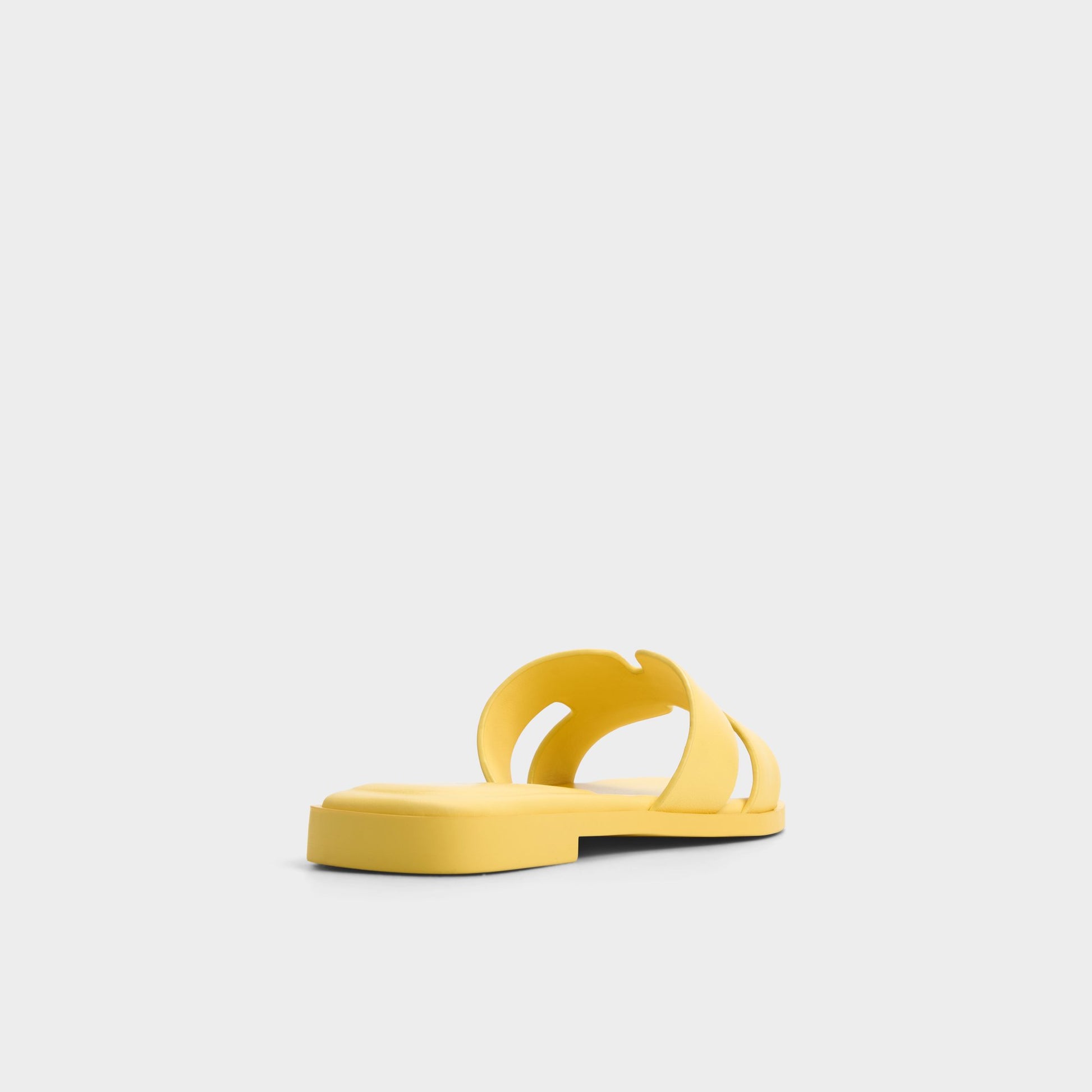 Three-quarter angle of Yellow Itsandal Slide sandal's back side