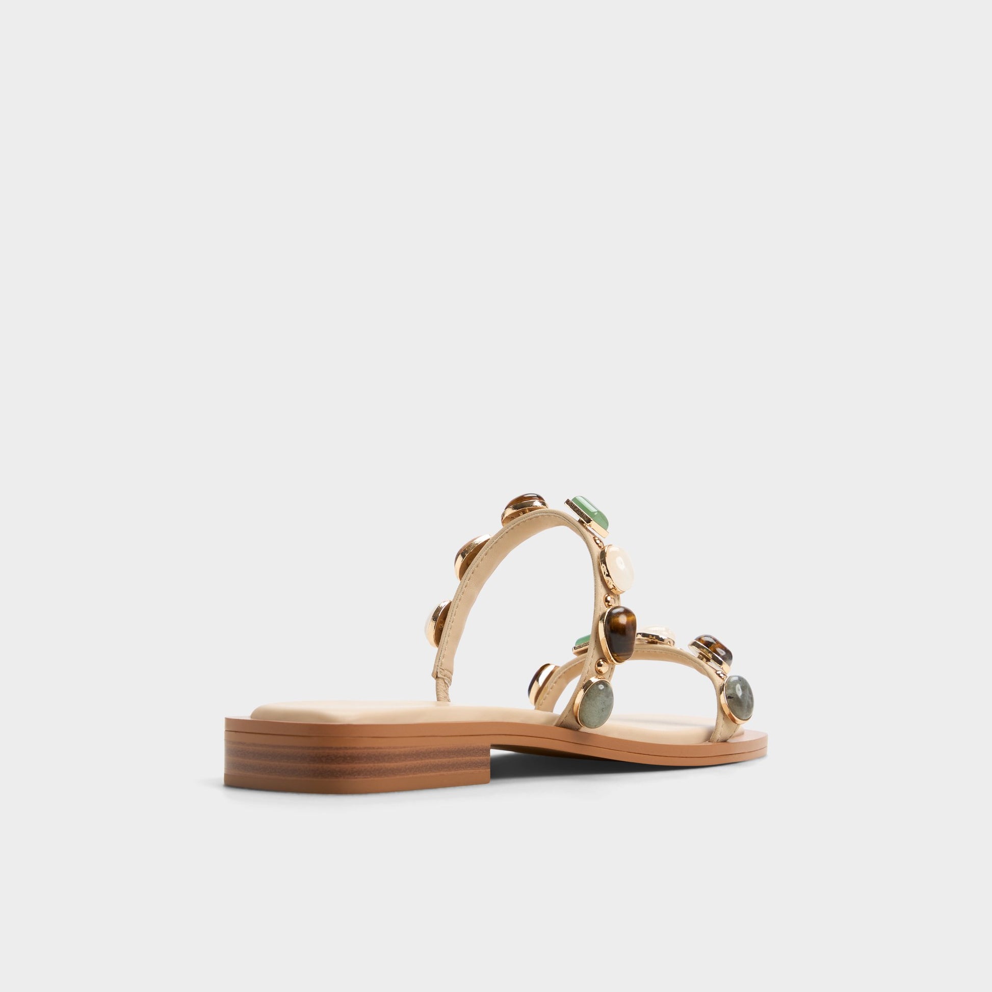 Three-quarter angle of Medium Beige Sapphira Strappy flat sandal's back side