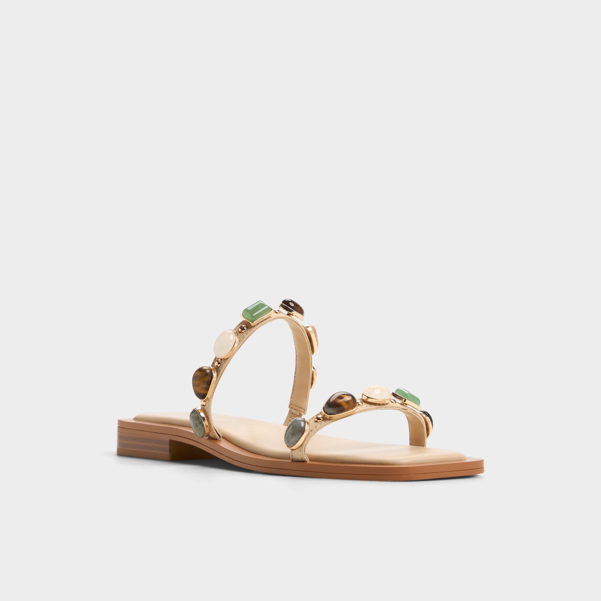 Three-quarter angle of Medium Beige Sapphira Strappy flat sandal's front side