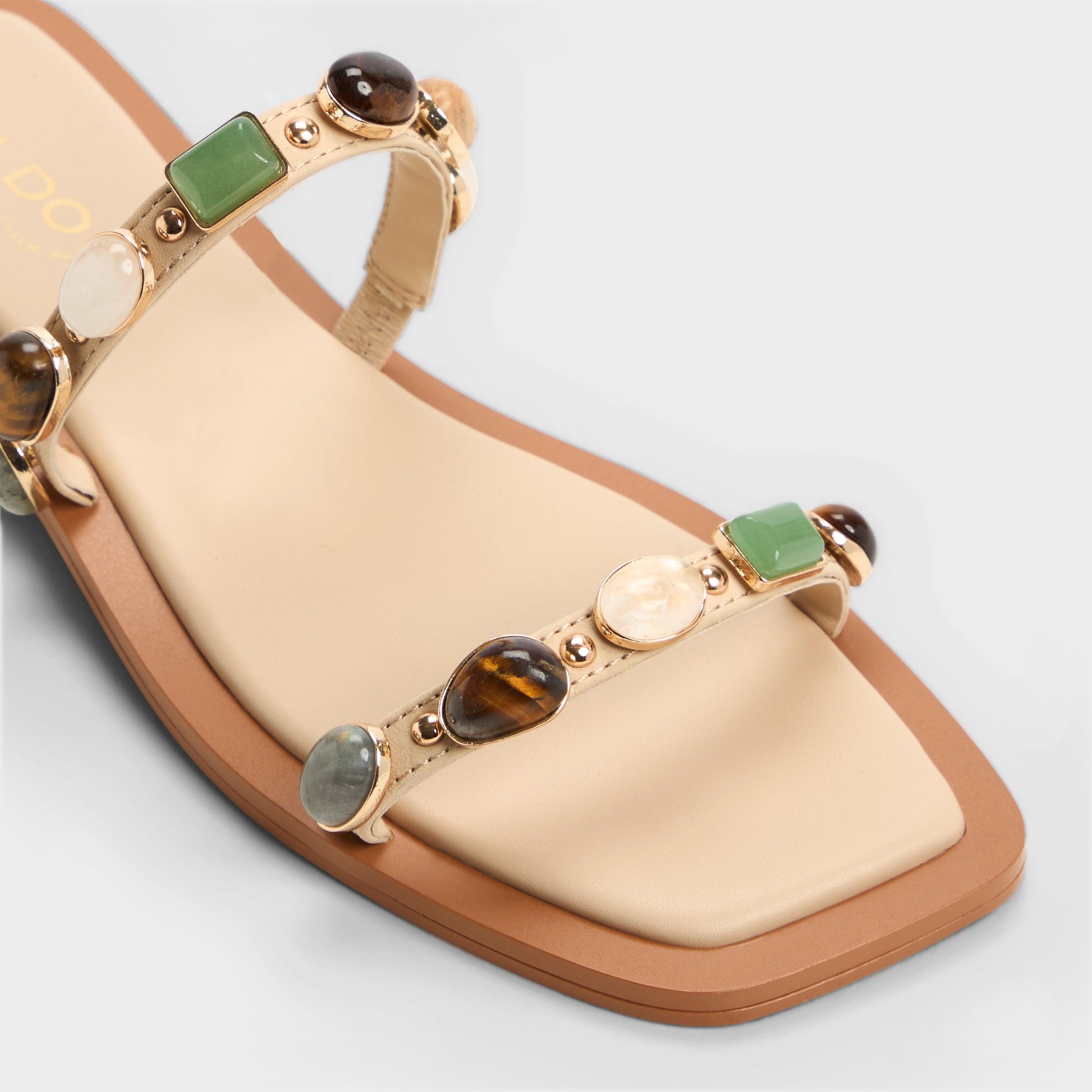 Close-up of the Medium Beige Sapphira Strappy flat sandal