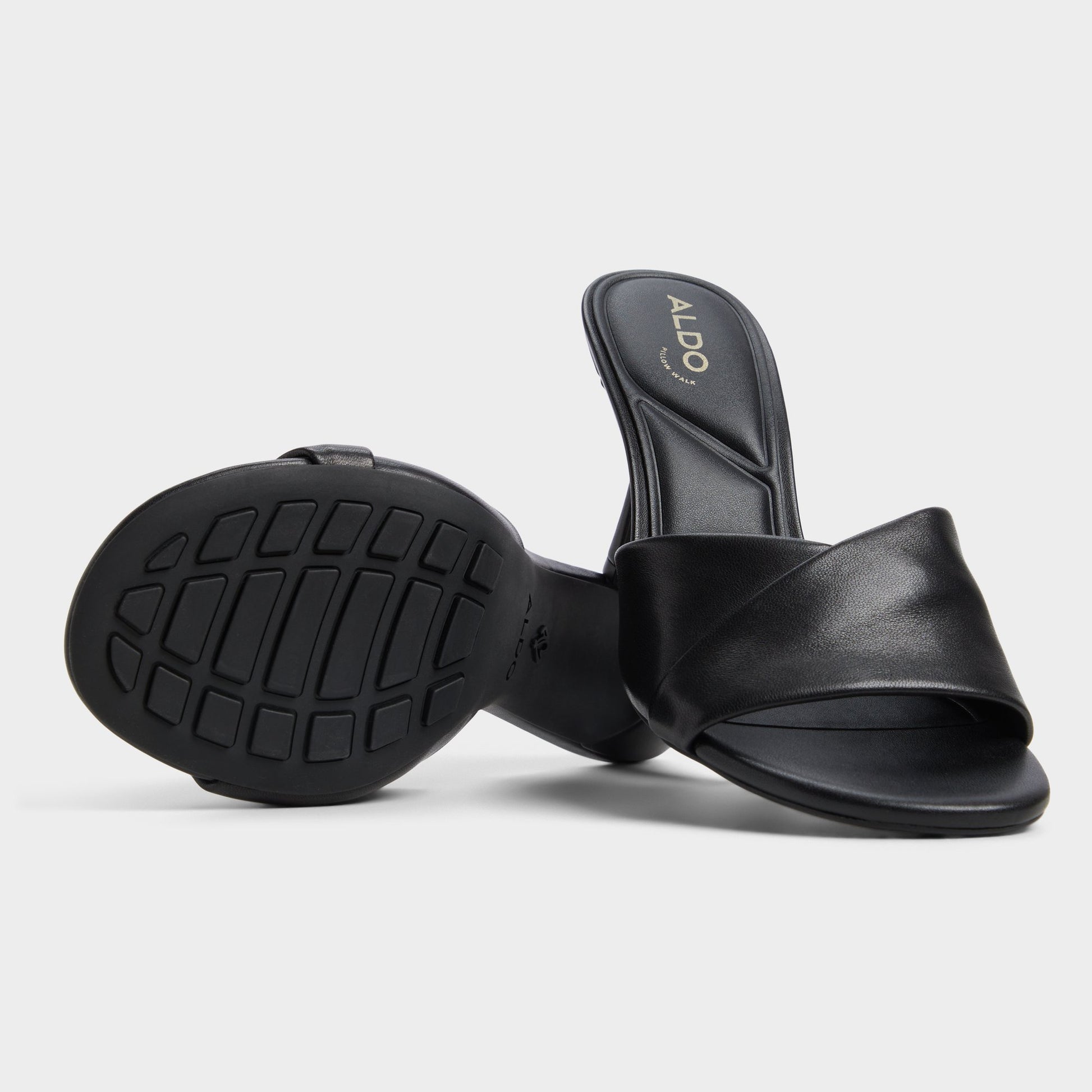 Highlighted view of a pair of Black Lyhanna Heeled mules