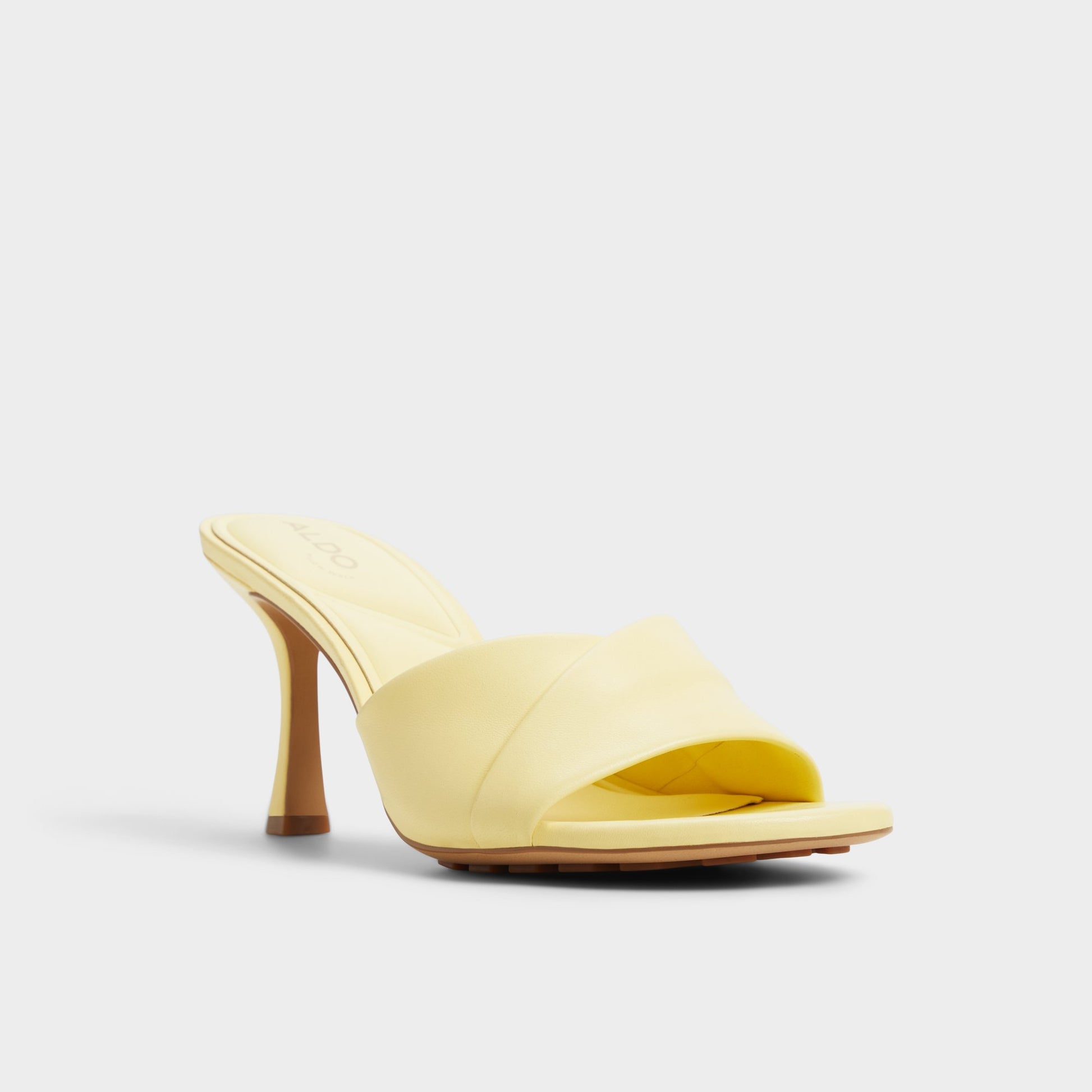 Three-quarter angle of Light Yellow Lyhanna Heeled mule's front side