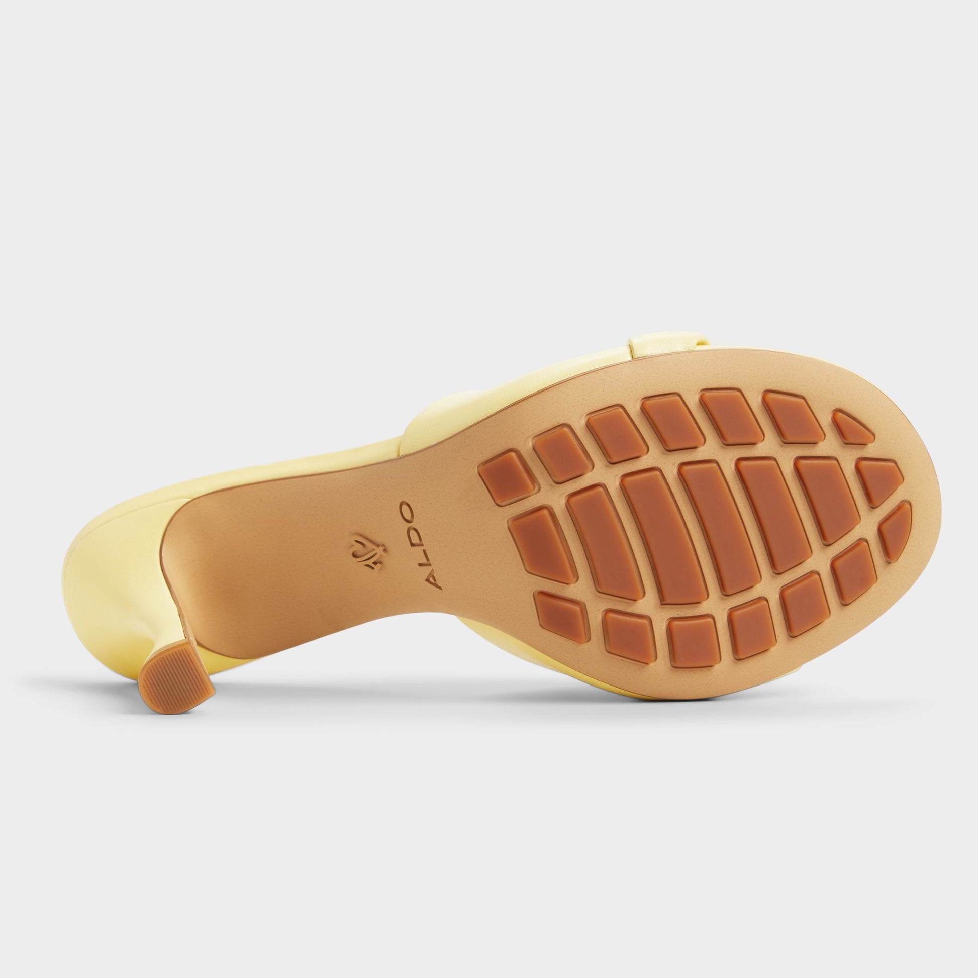 Highlighted view of a pair of Light Yellow Lyhanna Heeled mules