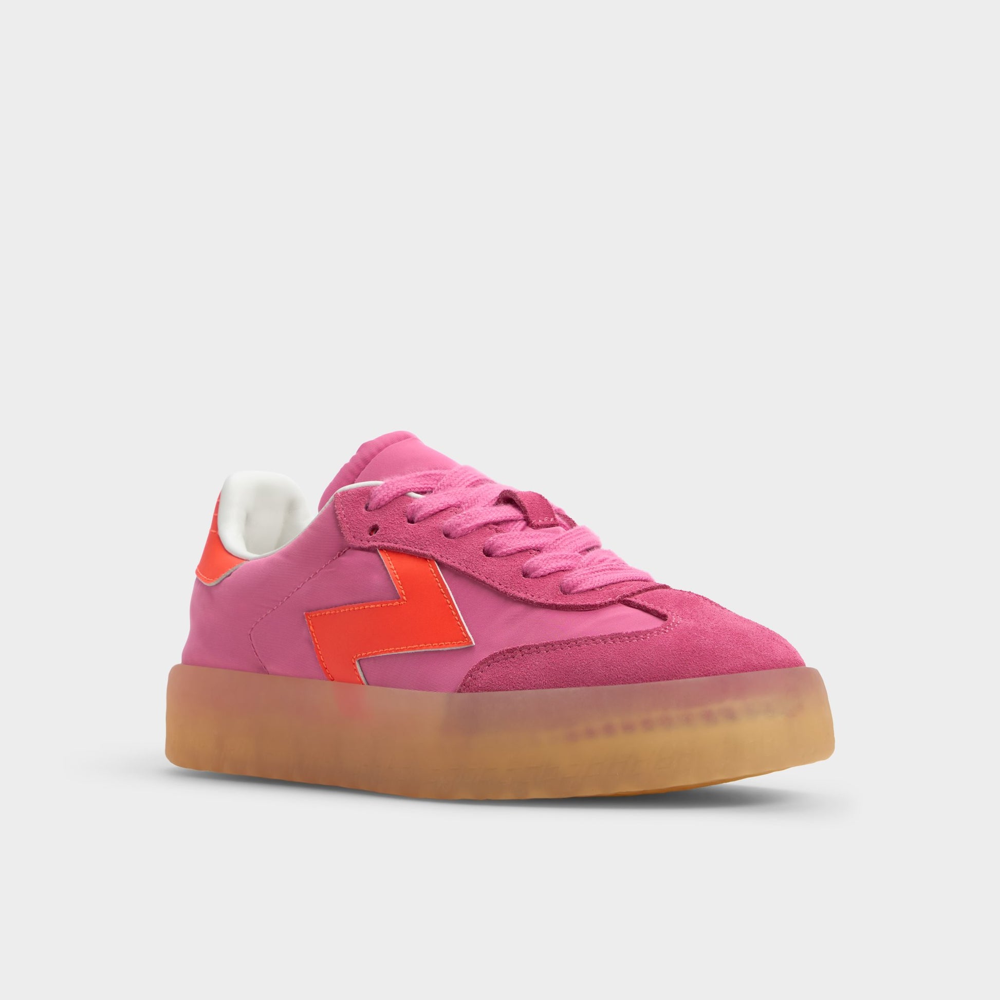 Three-quarter angle of Bright Pink Retrostep Low top sneaker's front side