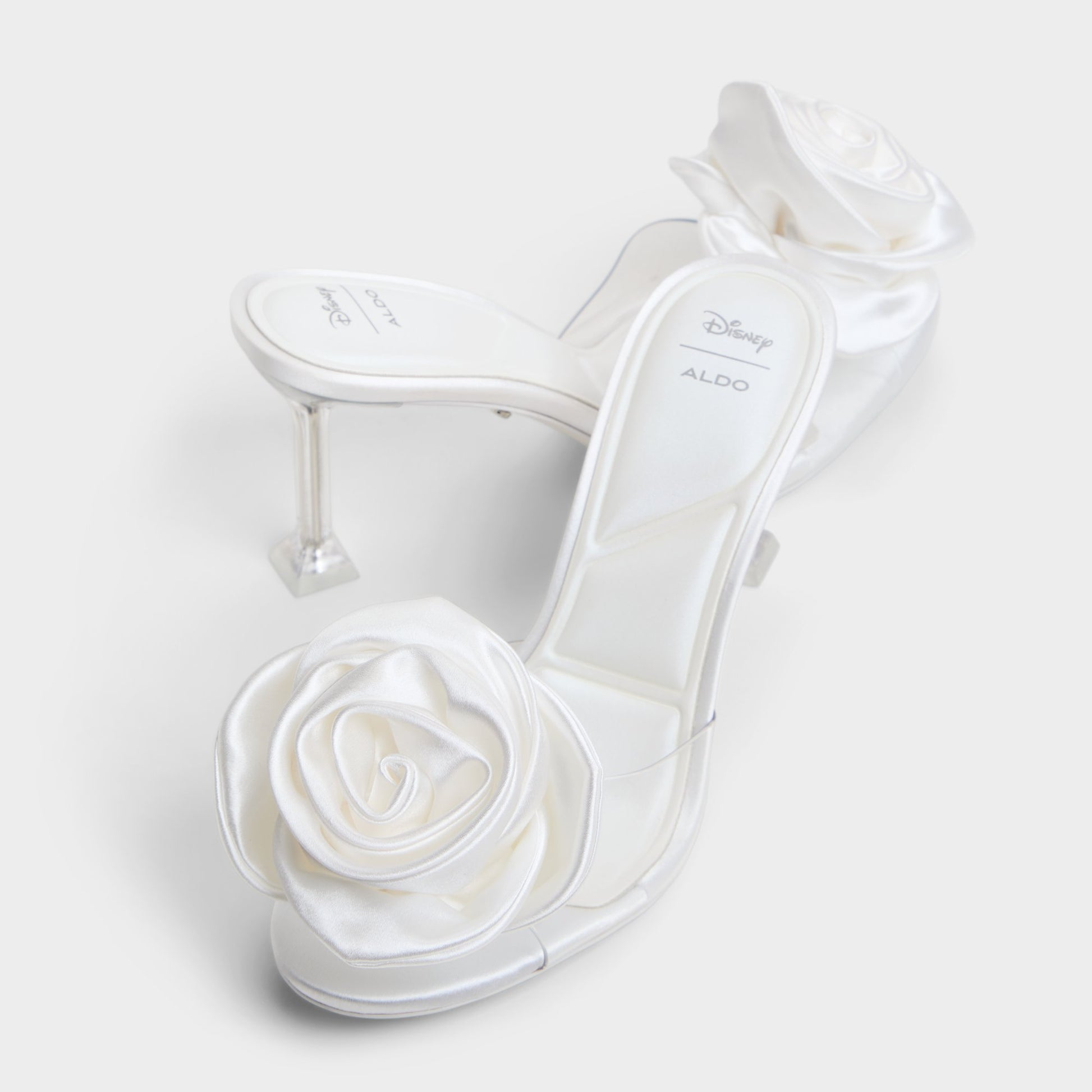 Highlighted view of a pair of White Cinderellamule Disney | ALDOs