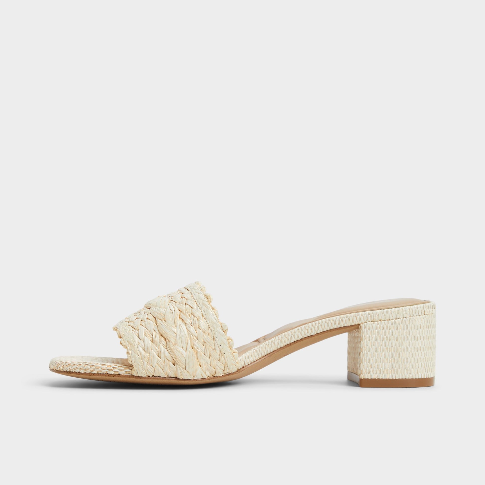 Side view of Natural Claudina Heeled mule