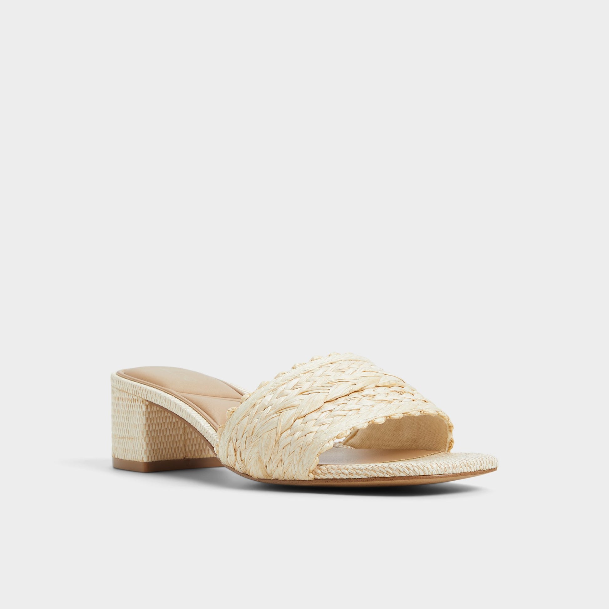 Three-quarter angle of Natural Claudina Heeled mule's front side