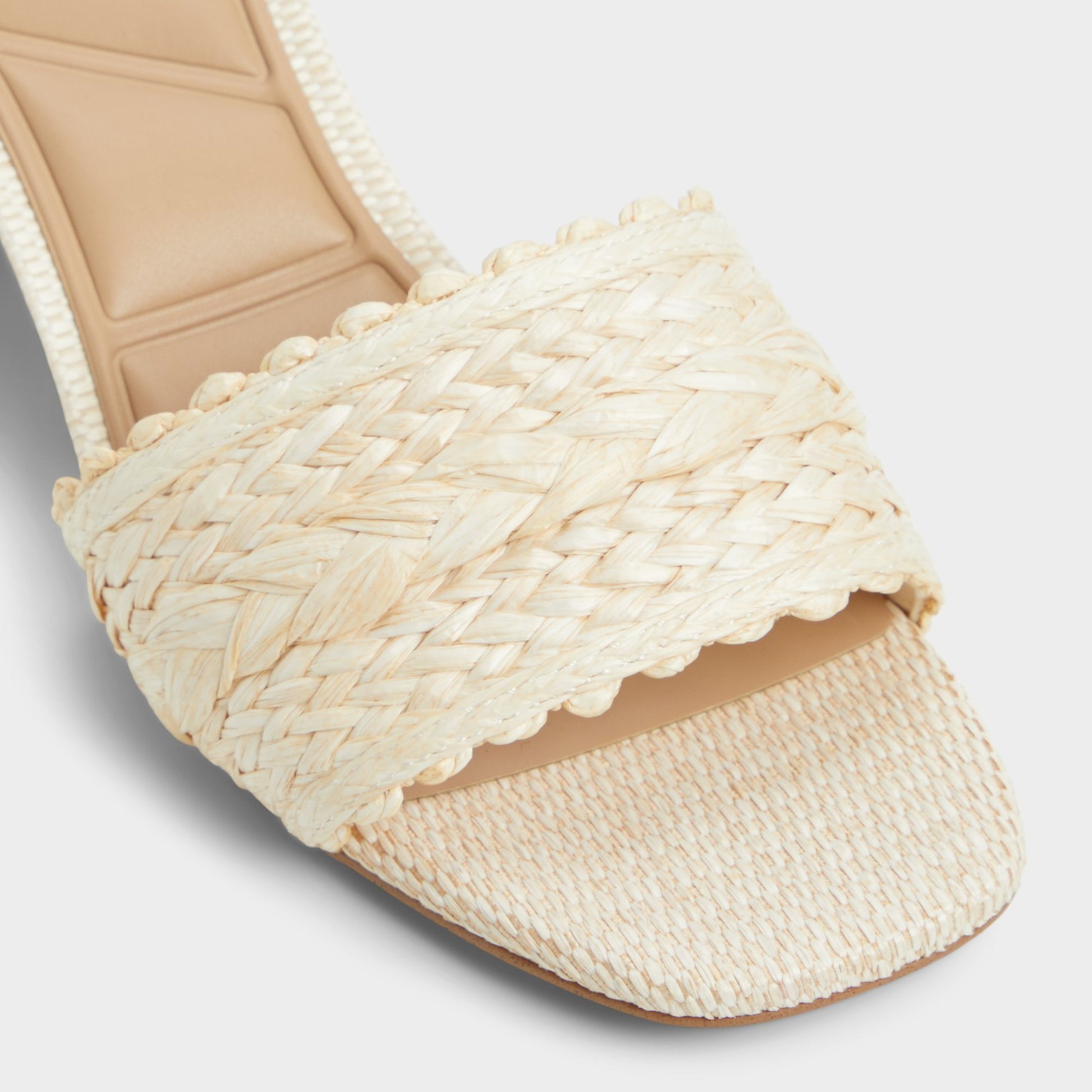 Close-up of the Natural Claudina Heeled mule