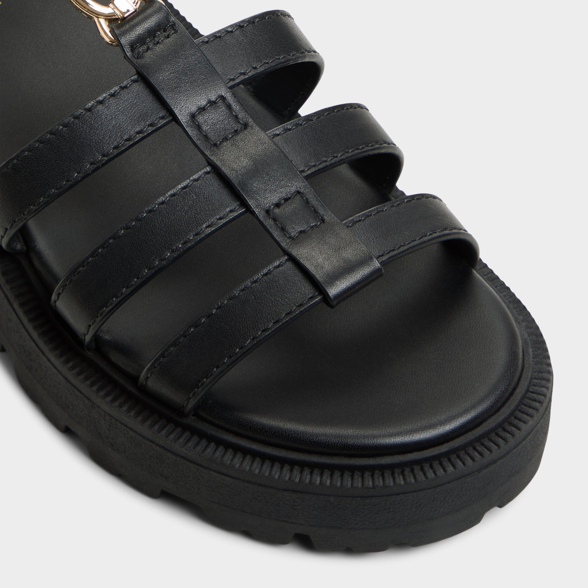 Close-up of the Black Lamington Gladiator sandal