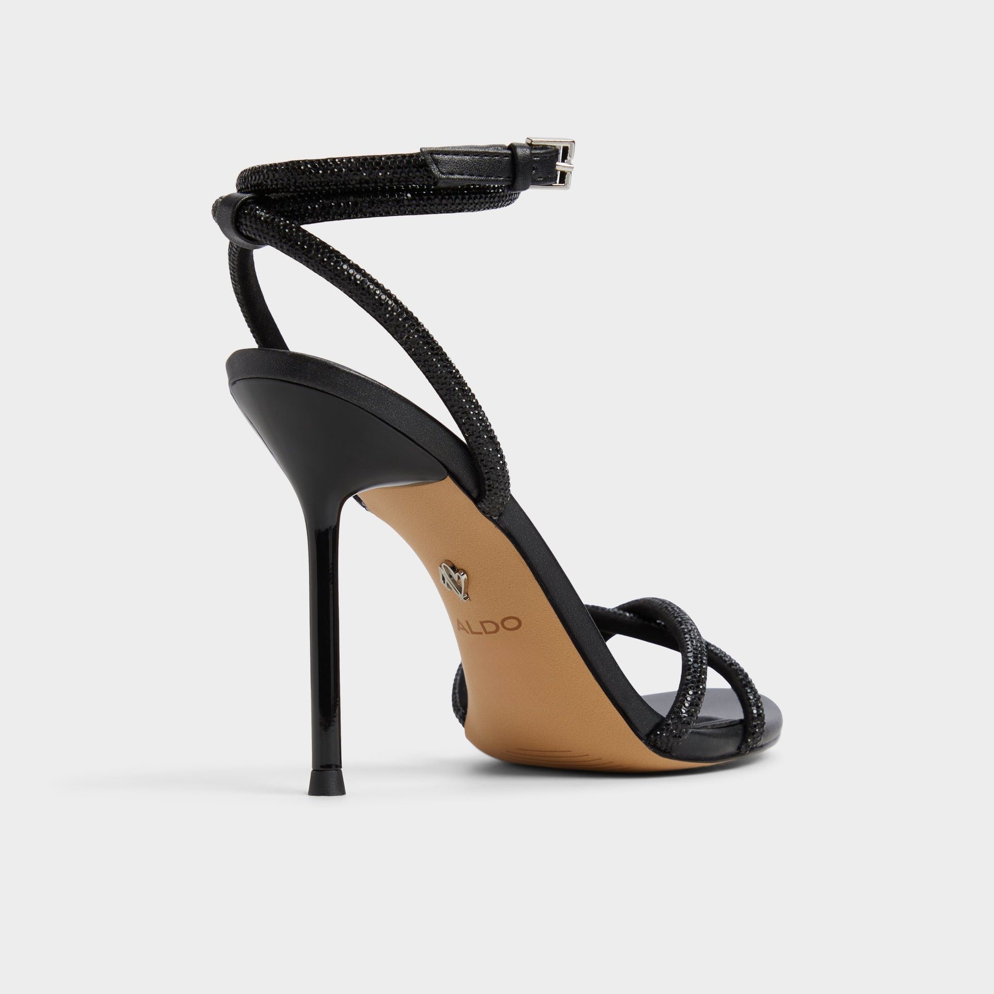 Three-quarter angle of Black Manaelden Strappy heeled sandal's back side