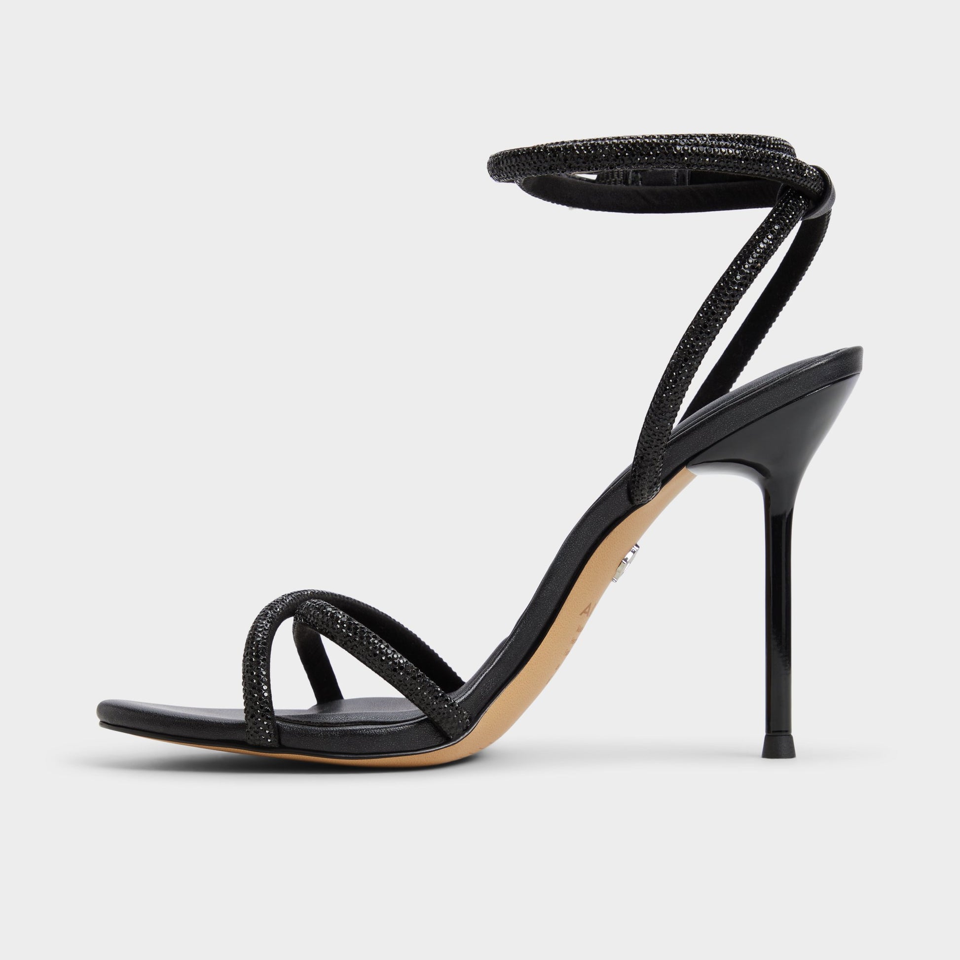 Side view of Black Manaelden Strappy heeled sandal