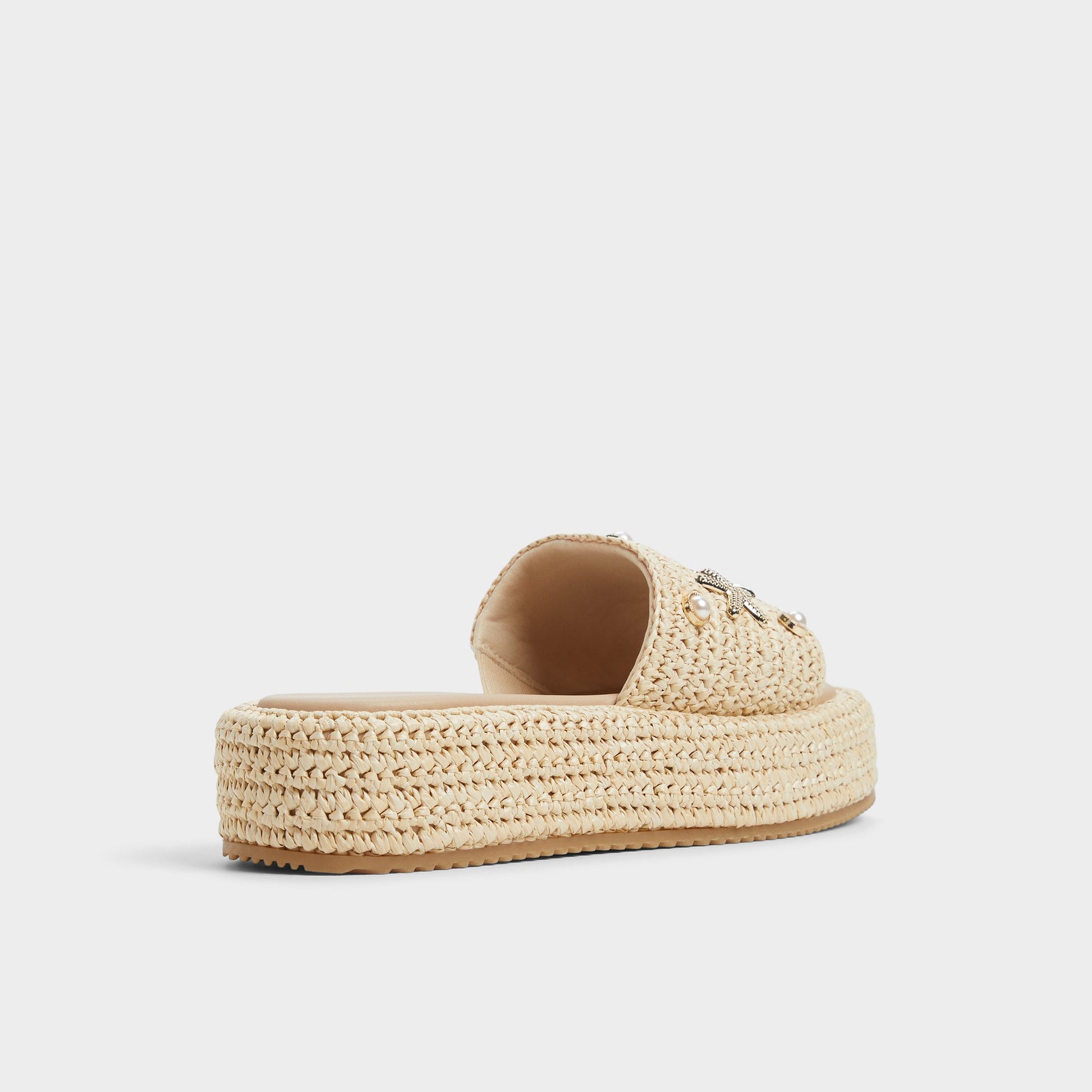 Three-quarter angle of Natural Corallo Flatform sandal's back side