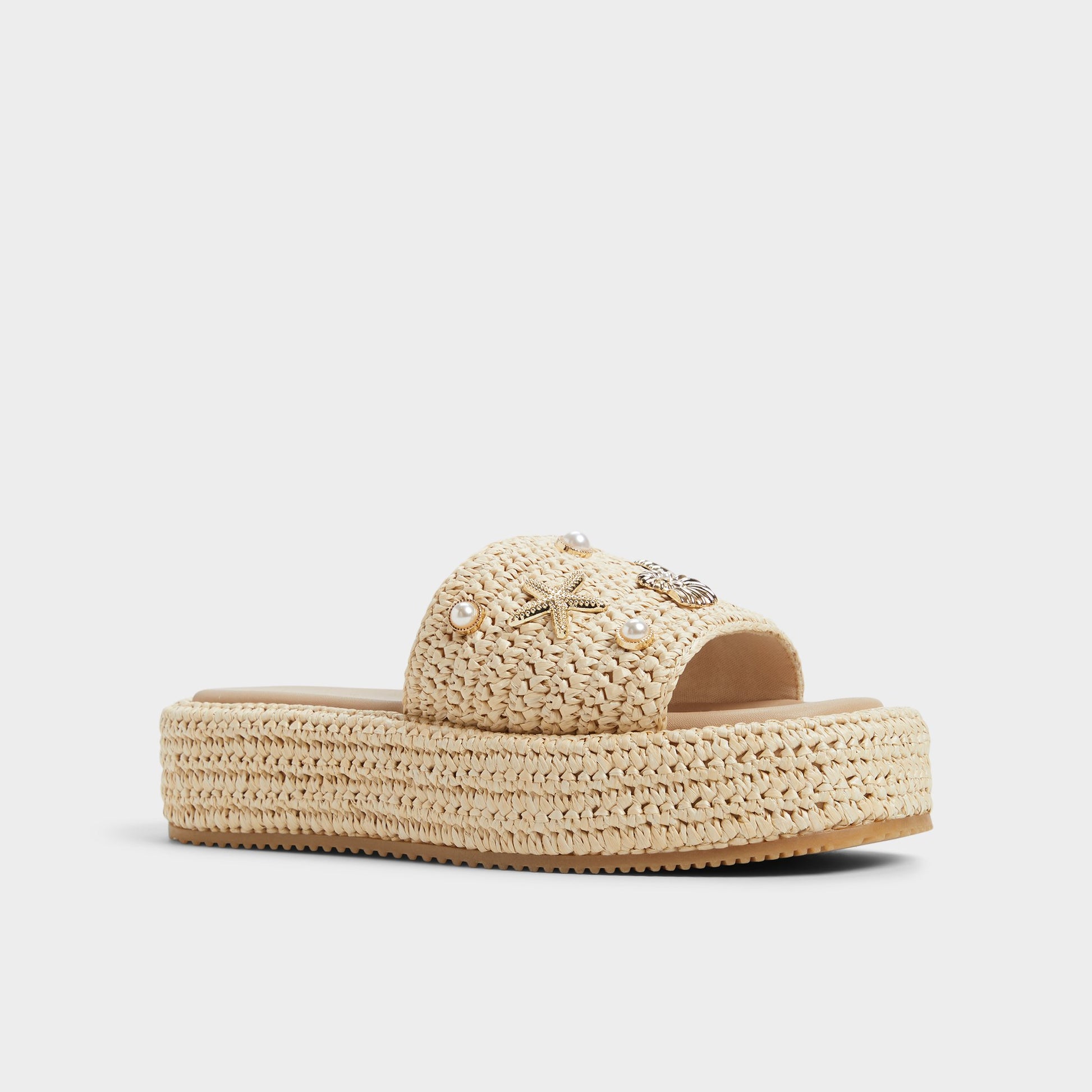 Three-quarter angle of Natural Corallo Flatform sandal's front side