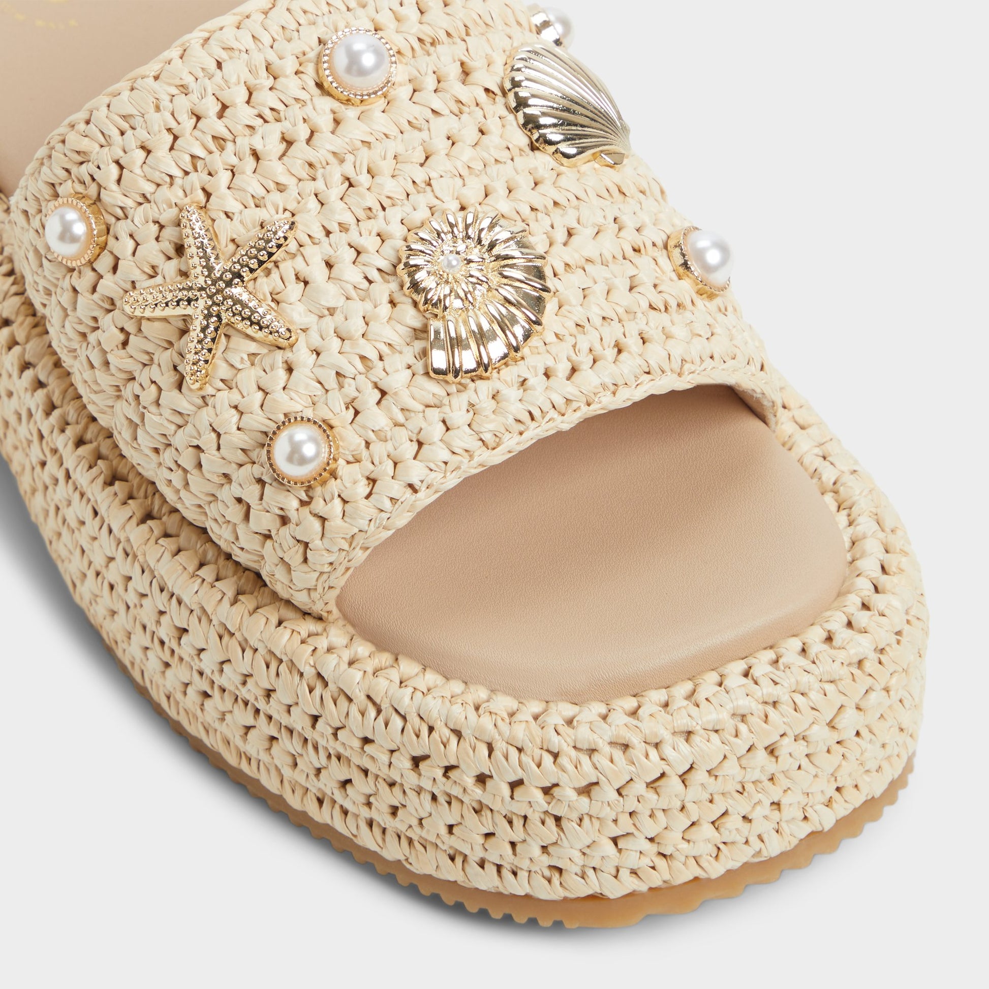 Close-up of the Natural Corallo Flatform sandal