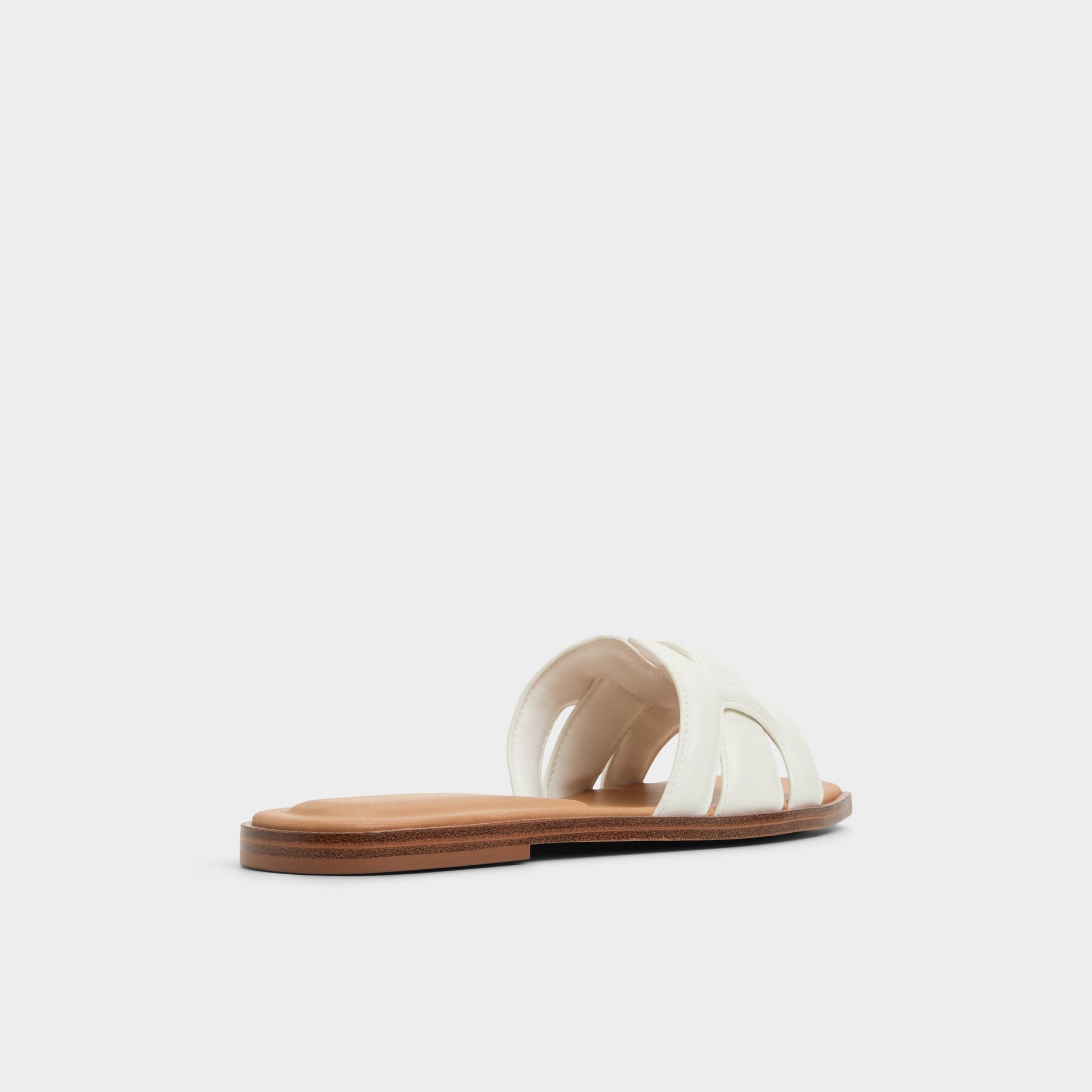 Three-quarter angle of White Eleny Slide sandal's back side
