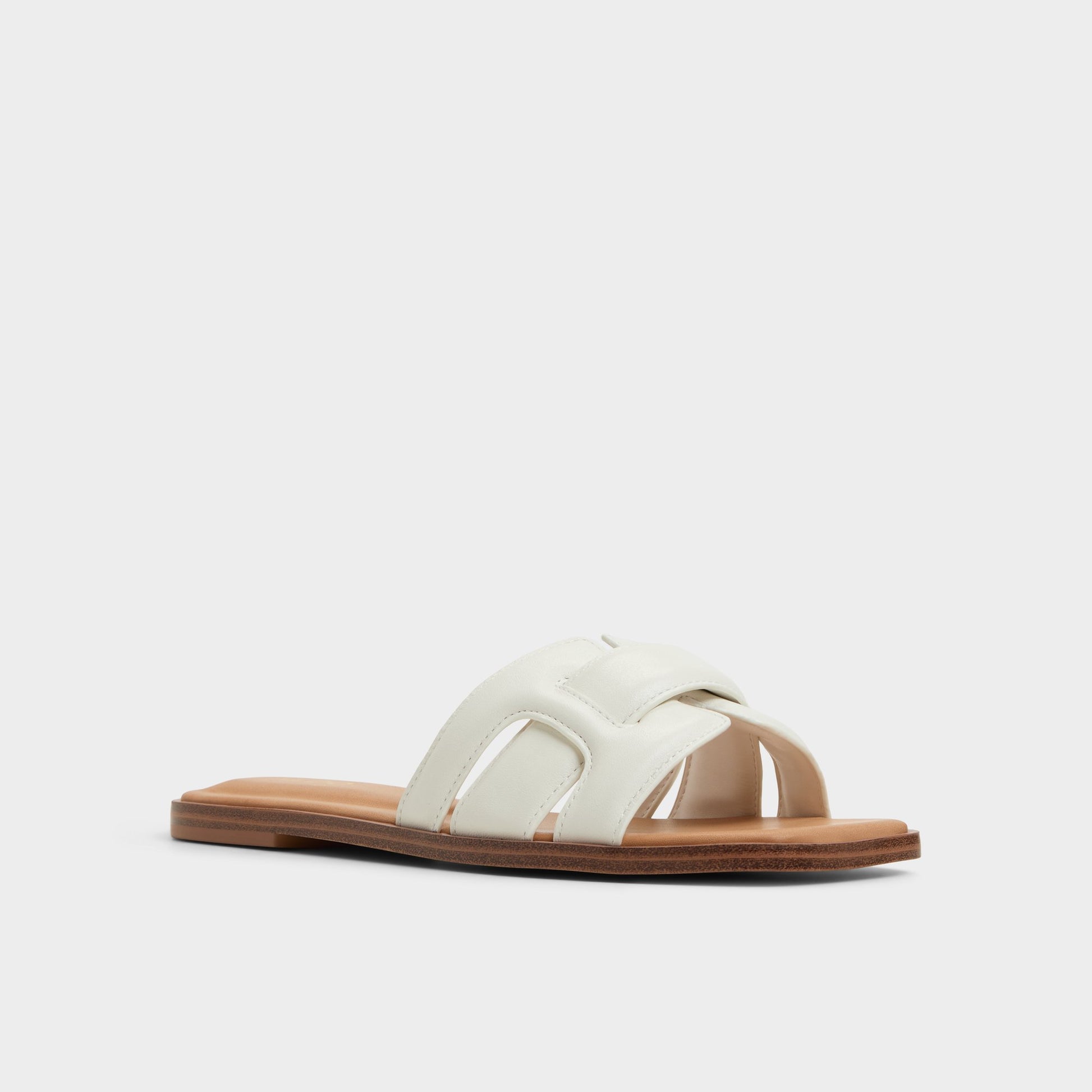 Three-quarter angle of White Eleny Slide sandal's front side