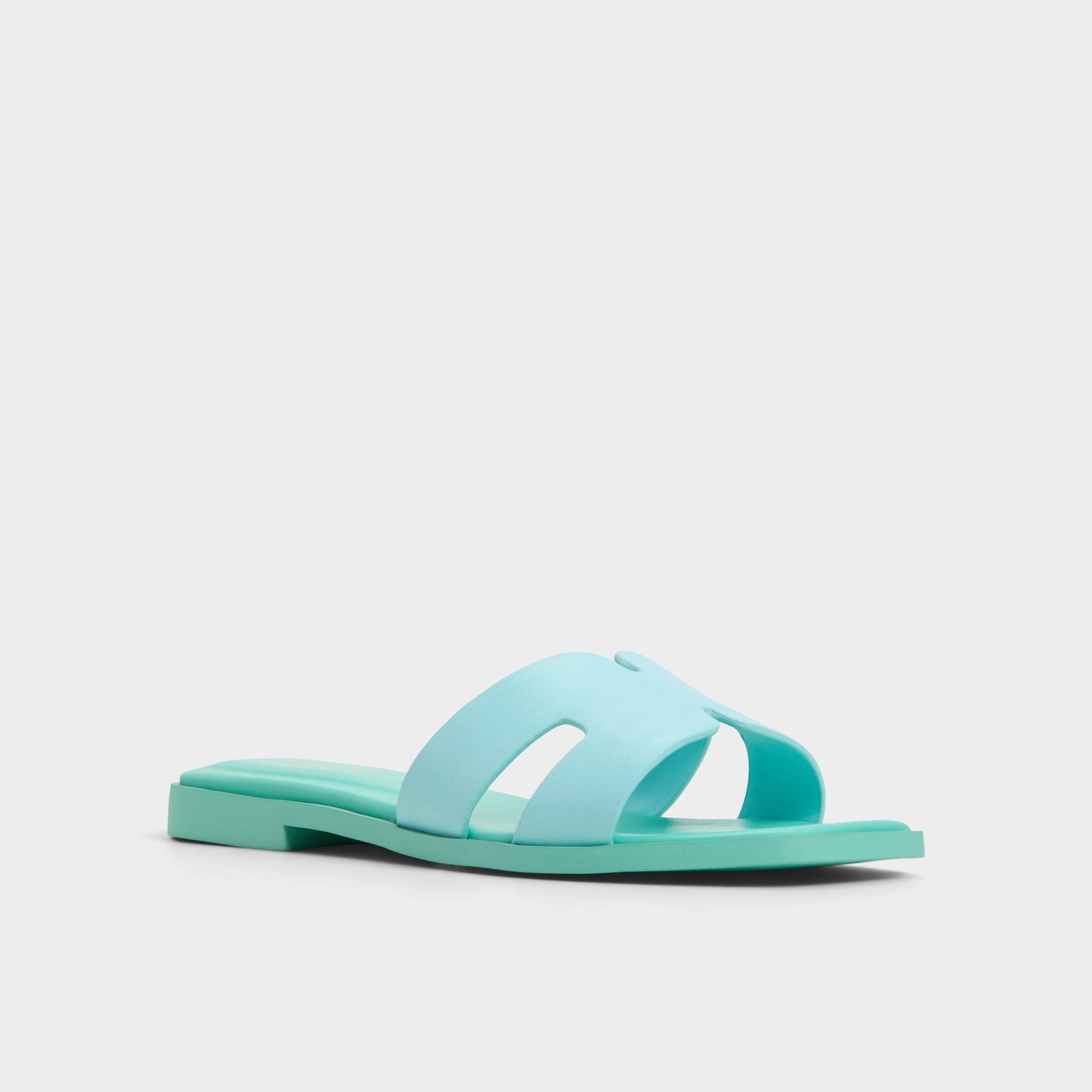 Three-quarter angle of Turquoise Itsandal Slide sandal's front side