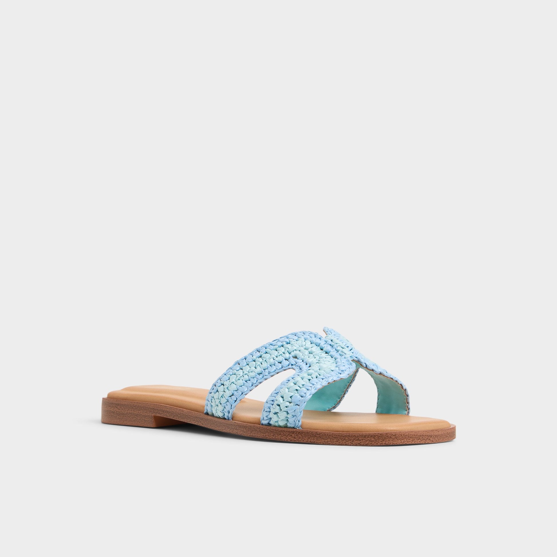 Three-quarter angle of Blue Combo Itsandal Slide sandal's front side