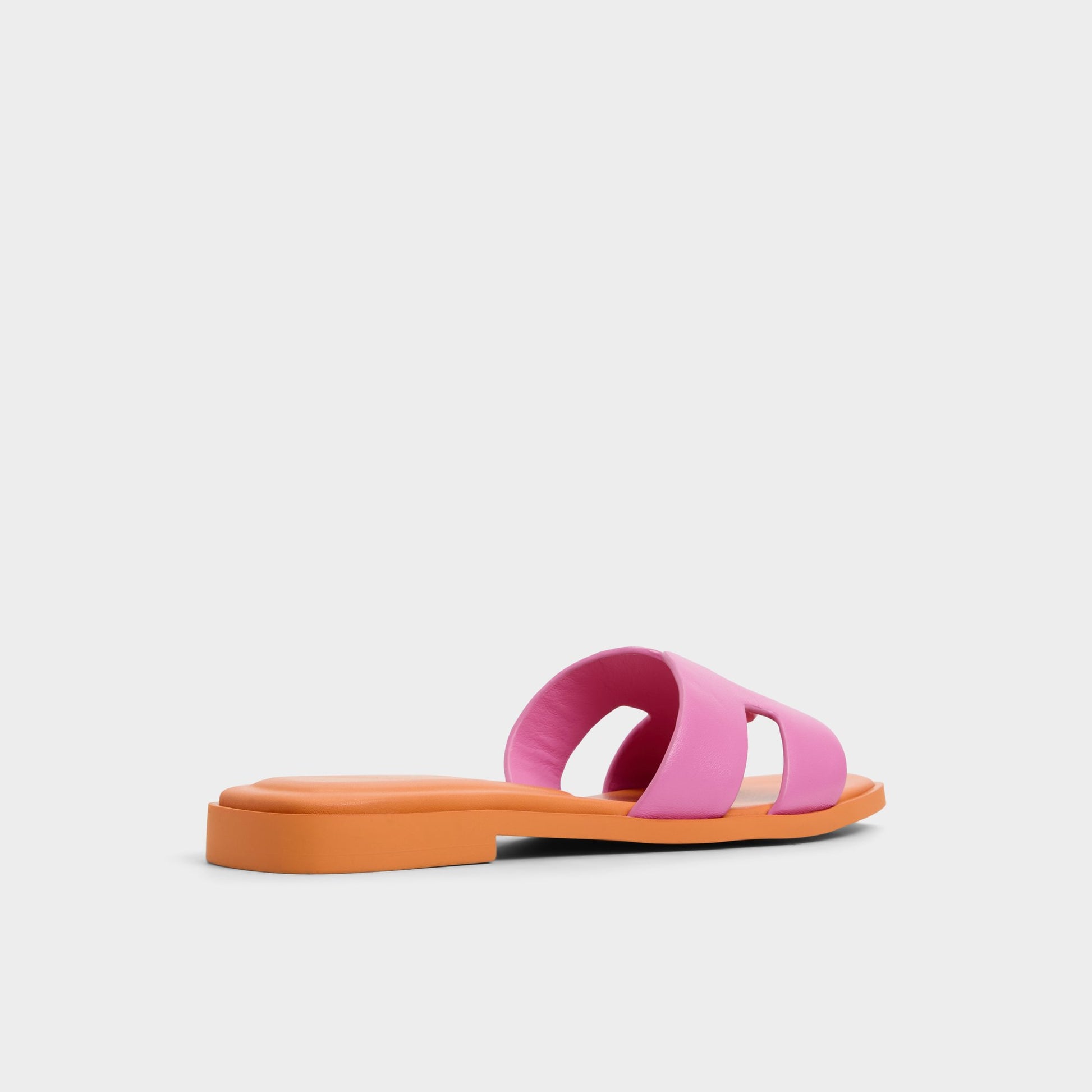 Three-quarter angle of Bright Pink Itsandal Slide sandal's back side