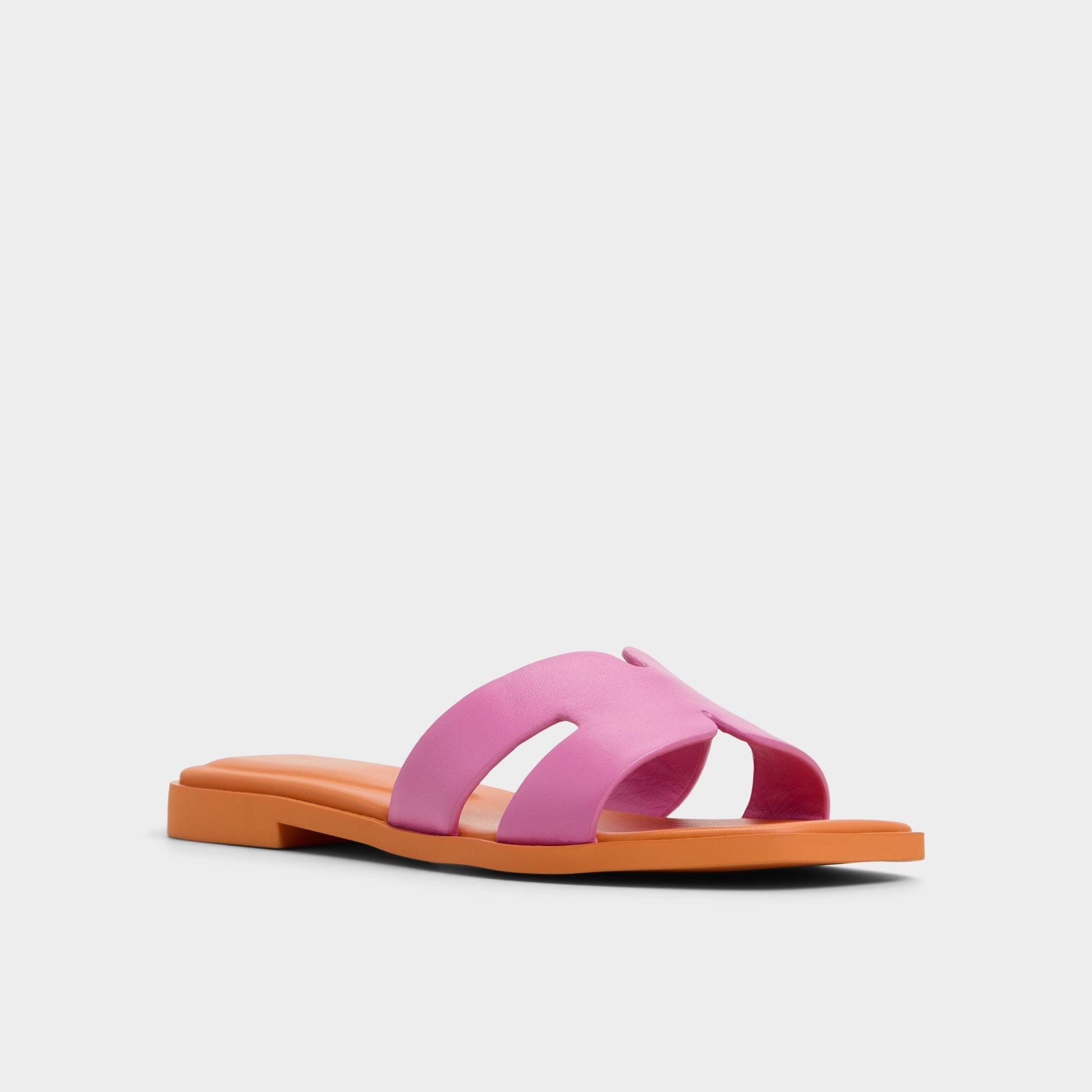 Three-quarter angle of Bright Pink Itsandal Slide sandal's front side