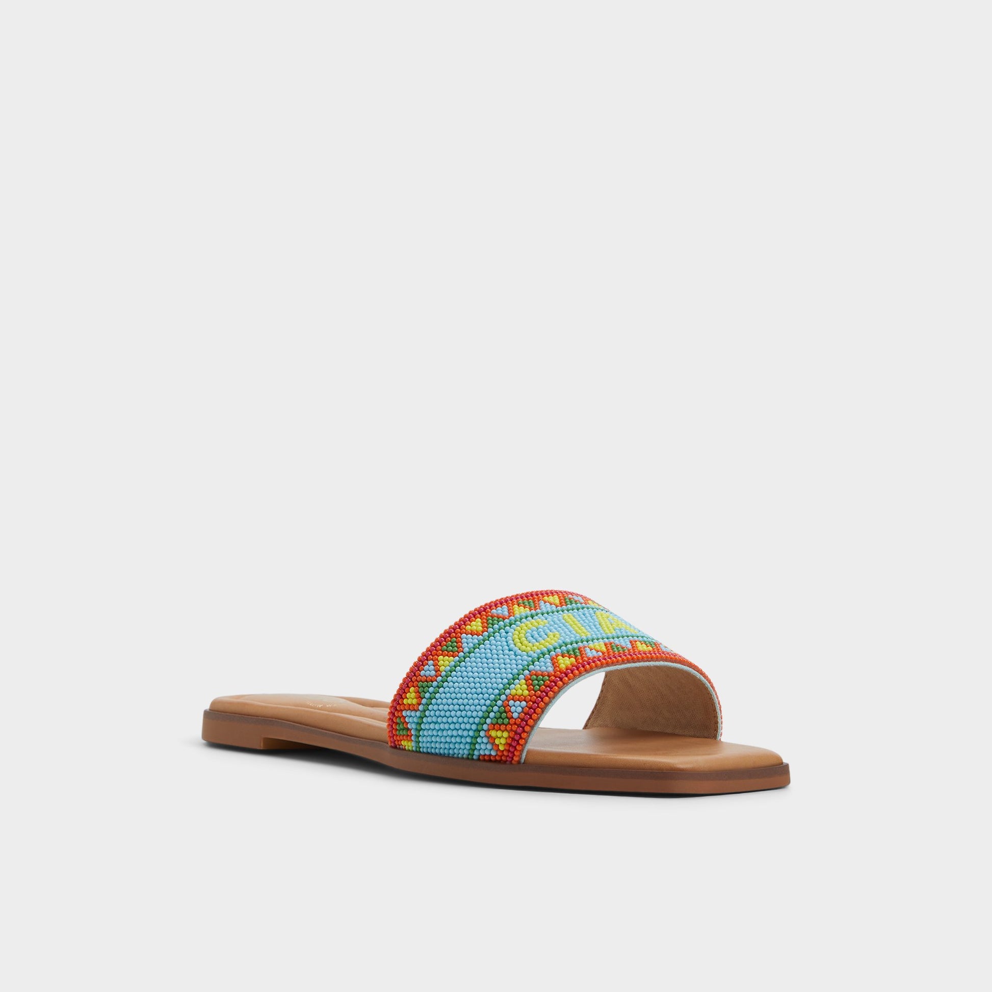 Three-quarter angle of Bright Multi Seavacay Slide sandal's front side