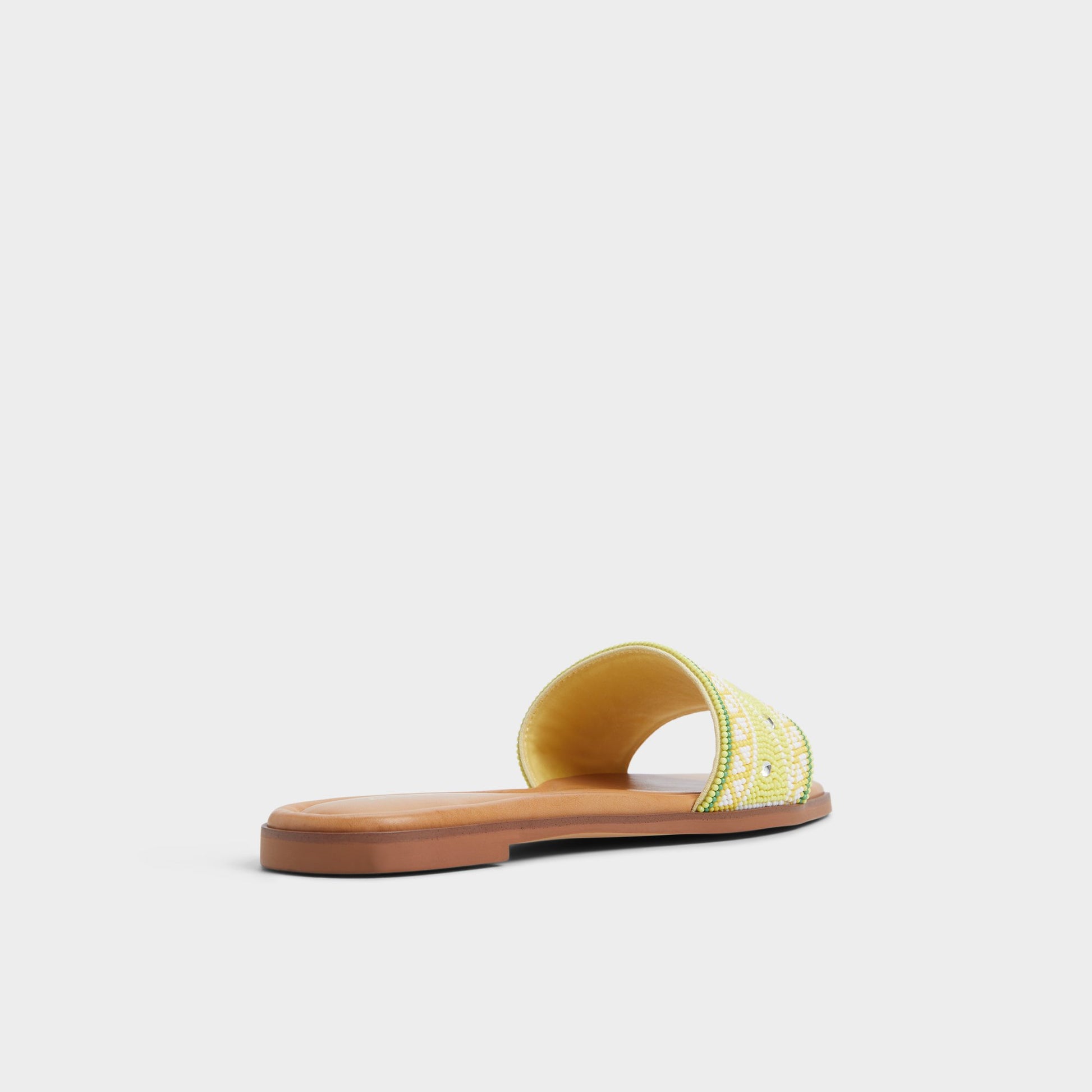 Three-quarter angle of Bright Yellow Seavacay Slide sandal's back side