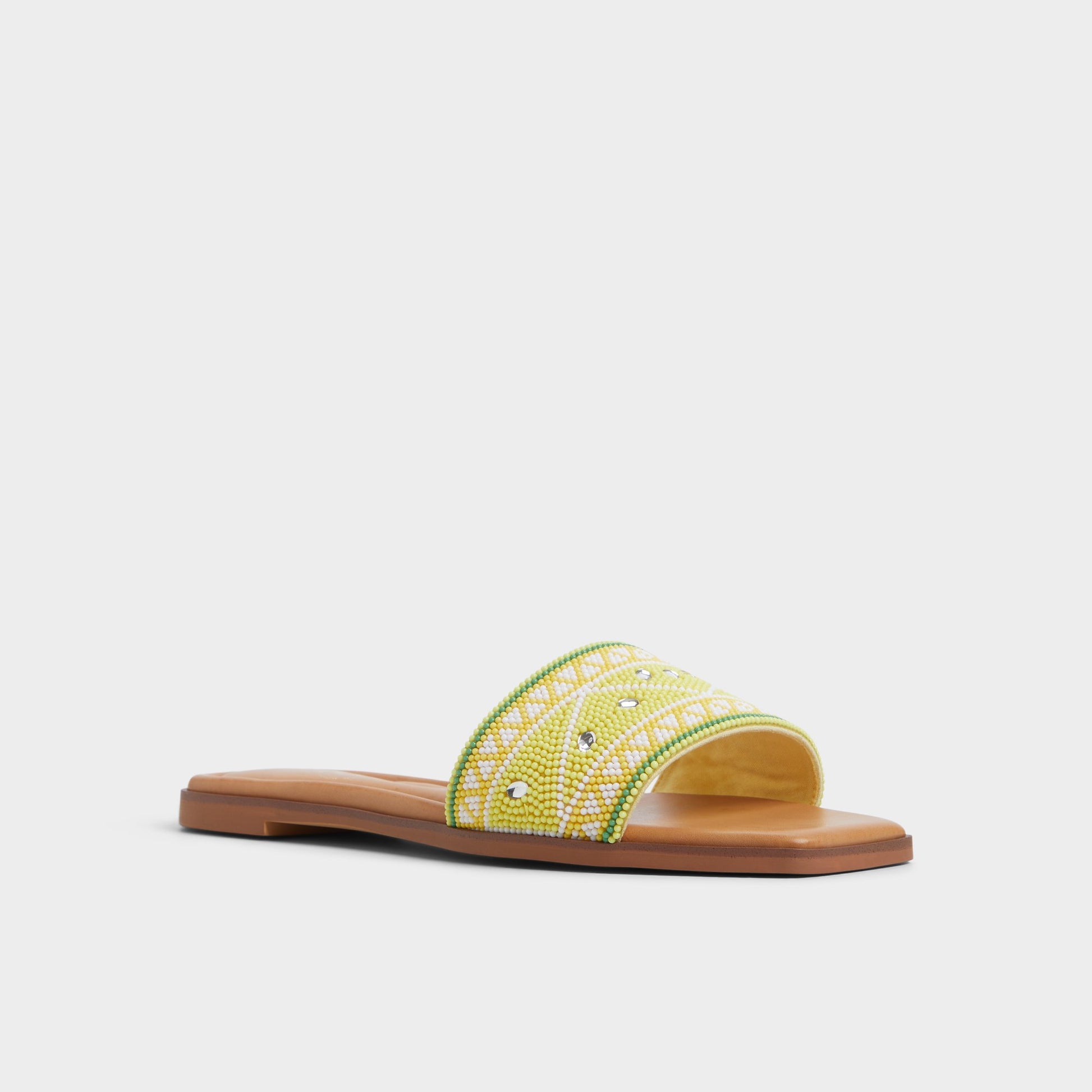 Three-quarter angle of Bright Yellow Seavacay Slide sandal's front side